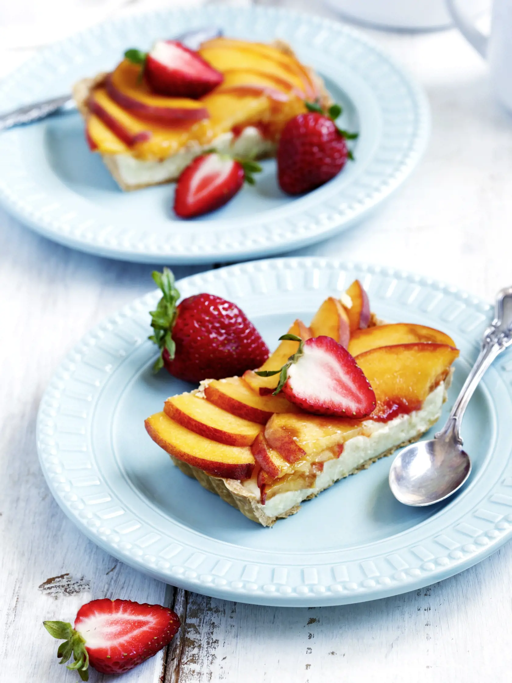 Tart with cream Diplomat, peaches and strawberry