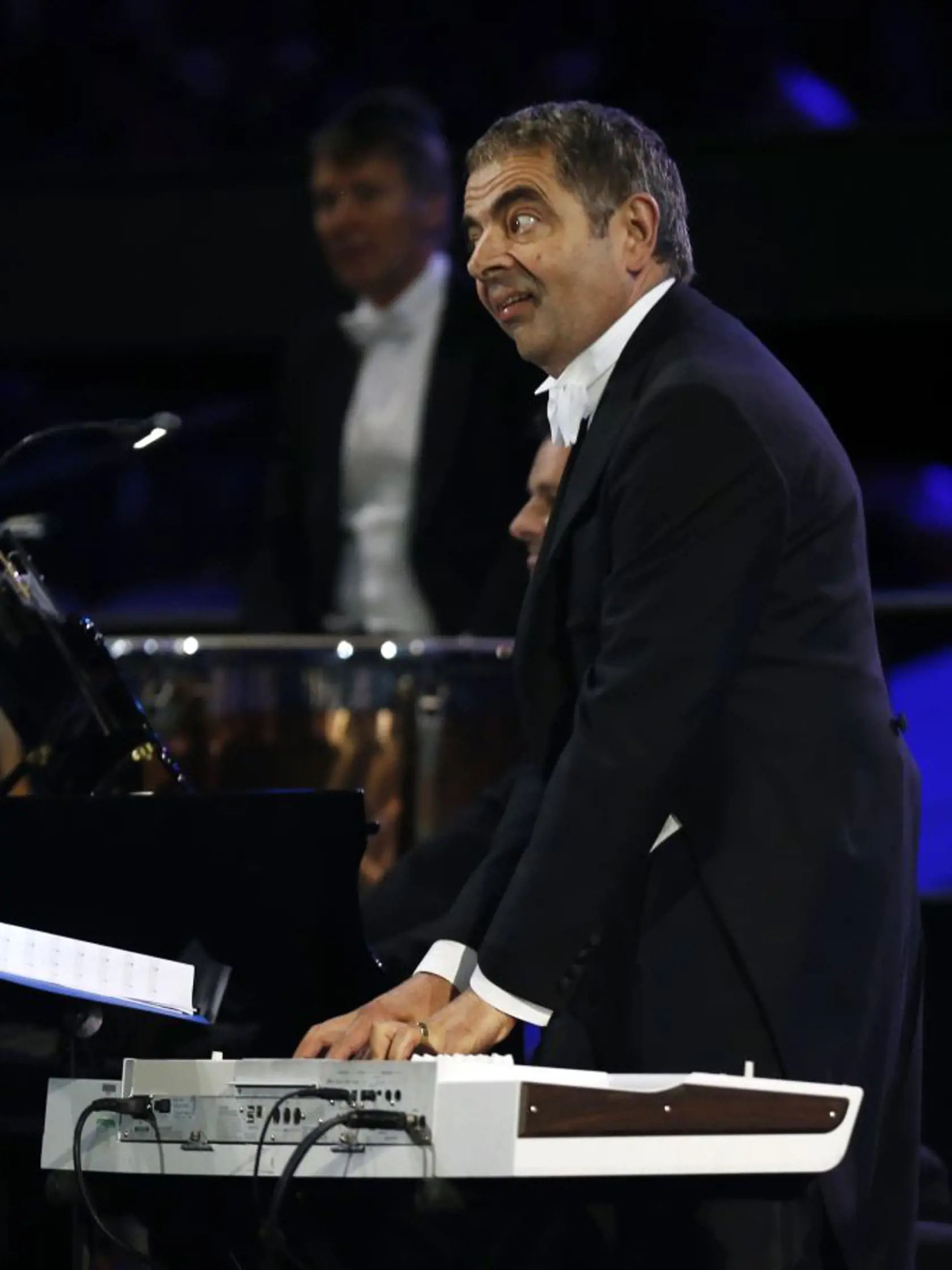 Actor Rowan Atkinson performs during the Opening Ceremony at the 2012 Summer Olympics, Friday, July 27, 2012, in London. (AP Photo/Matt Dunham)