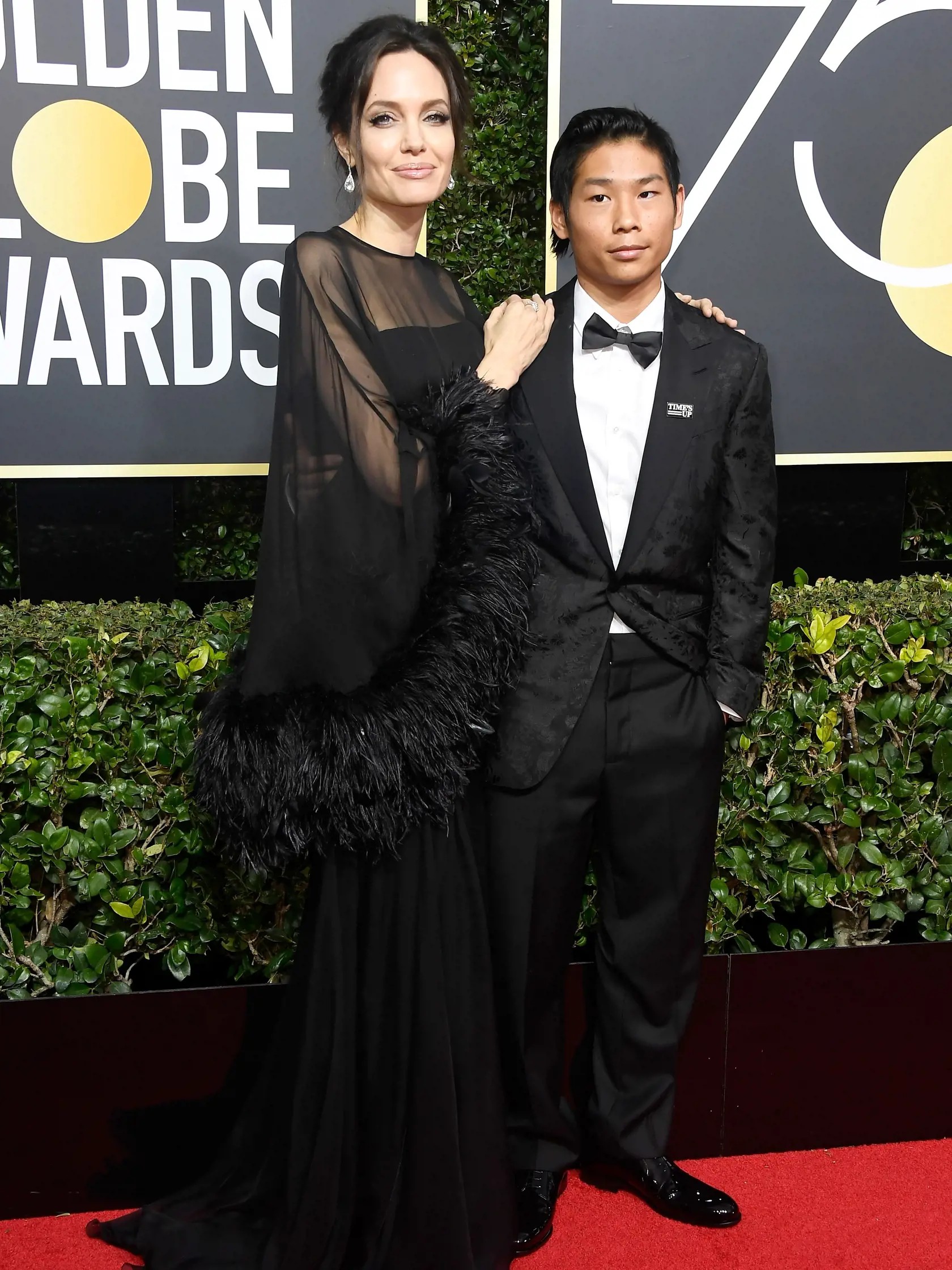 BEVERLY HILLS, CA - JANUARY 07:  Actor/director Angelina Jolie (L) and Pax Thien Jolie-Pitt attend The 75th Annual Golden Globe Awards at The Beverly Hilton Hotel on January 7, 2018 in Beverly Hills, California.  (Photo by Frazer Harrison/Getty Images)