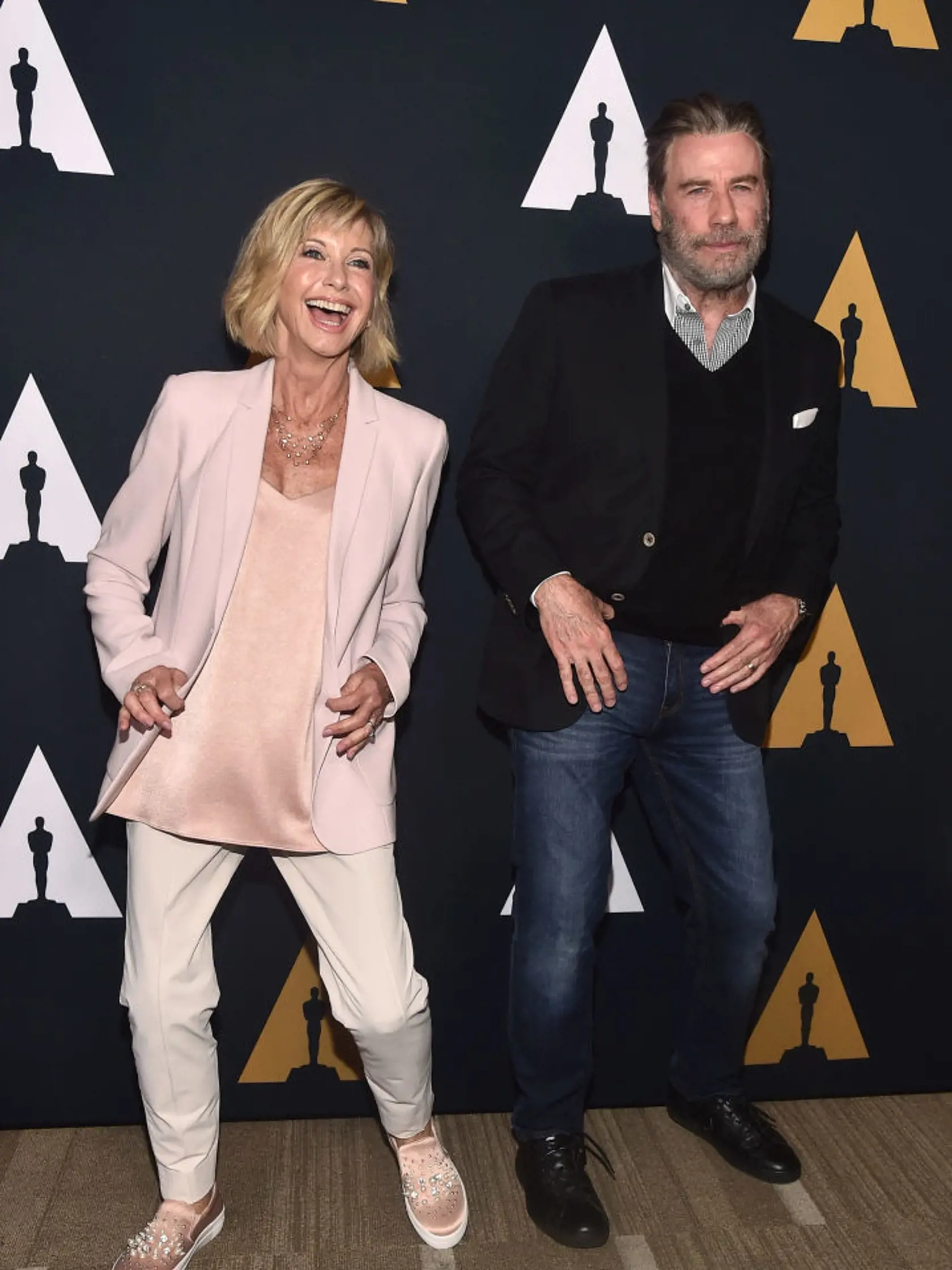 BEVERLY HILLS, CA - AUGUST 15:  Olivia Newton-John and John Travolta attend the Academy Presents "Grease" (1978) 40th Anniversary at the Samuel Goldwyn Theater on August 15, 2018 in Beverly Hills, California.  (Photo by Alberto E. Rodriguez/Getty Images)