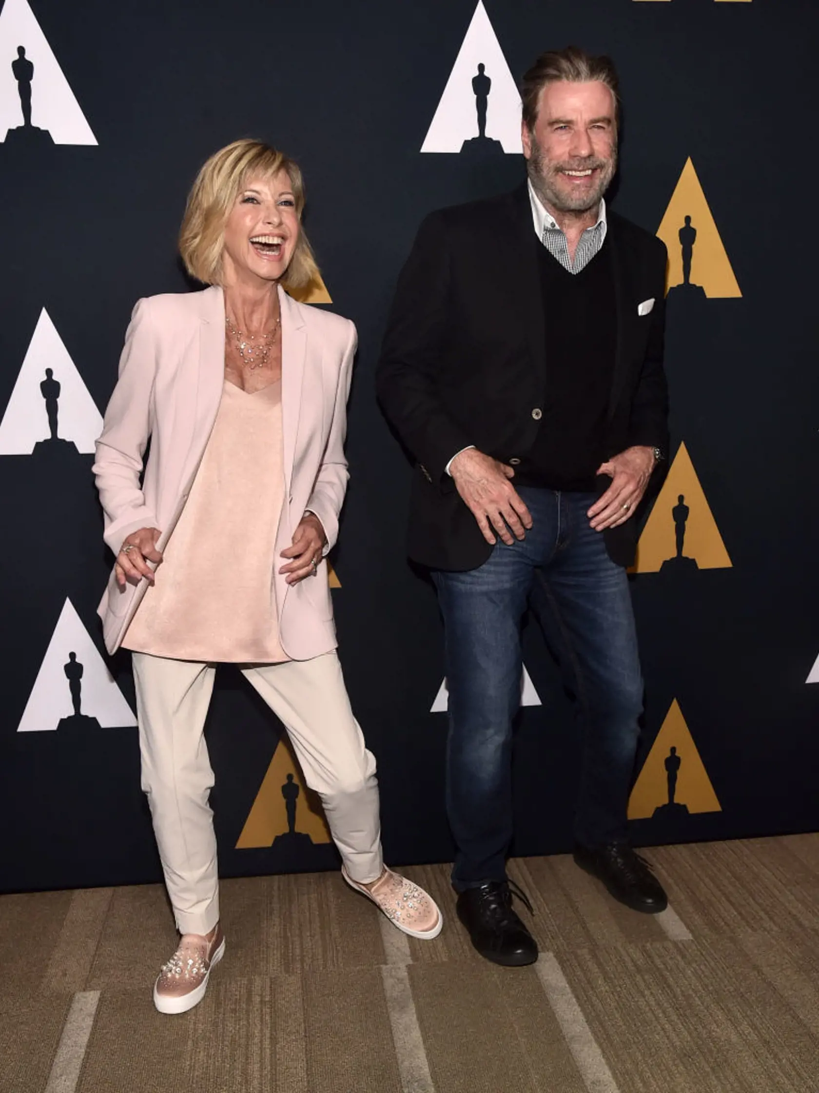 BEVERLY HILLS, CA - AUGUST 15:  Olivia Newton-John (L) and John Travolta attend the "Grease" 40th anniversary screening at Samuel Goldwyn Theater on August 15, 2018 in Beverly Hills, California.  (Photo by Alberto E. Rodriguez/Getty Images)