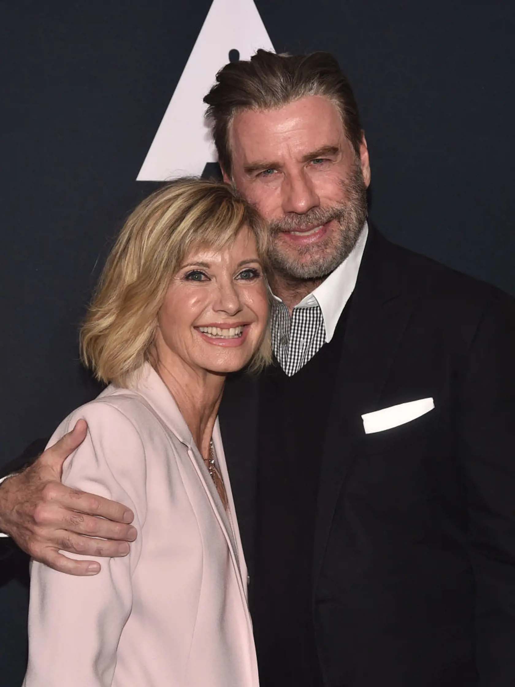 BEVERLY HILLS, CA - AUGUST 15:  Olivia Newton-John and John Travolta attend the Academy Presents "Grease" (1978) 40th Anniversary at the Samuel Goldwyn Theater on August 15, 2018 in Beverly Hills, California.  (Photo by Alberto E. Rodriguez/Getty Images)