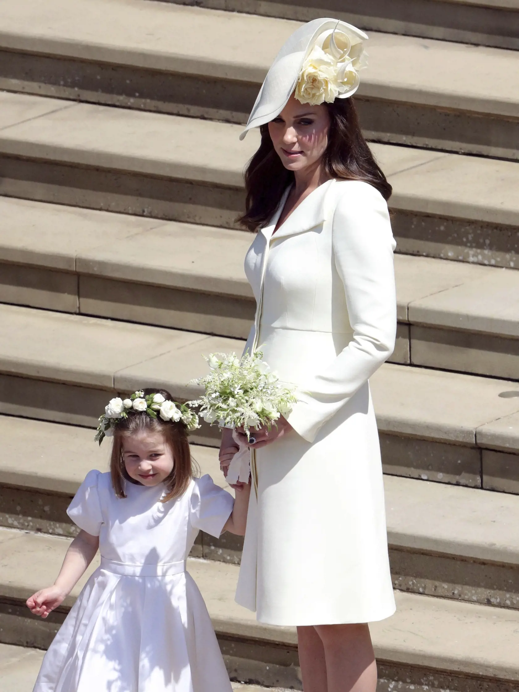 Kate Duchess of Cambridge and Princess Charlotte leave after the wedding ceremony of Prince Harry and Meghan Markle at St. George's Chapel in Windsor Castle in Windsor, near London, England, Saturday, May 19, 2018. (Andrew Matthews/pool photo via AP)