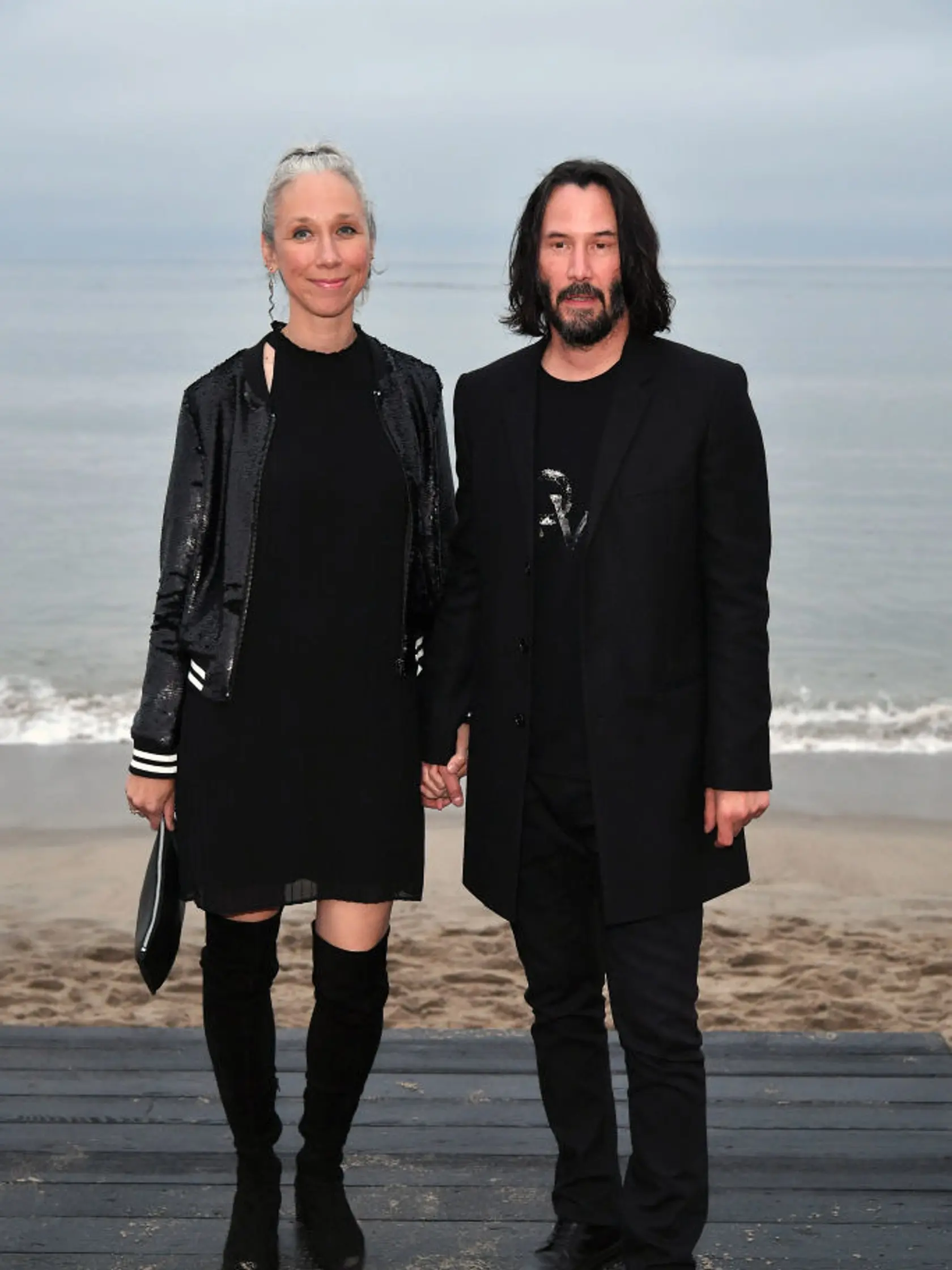 MALIBU, CALIFORNIA - JUNE 06: (L-R) Alexandra Grant and Keanu Reeves attends the Saint Laurent Mens Spring Summer 20 Show on June 06, 2019 in Paradise Cove Malibu, California. (Photo by Neilson Barnard/Getty Images)