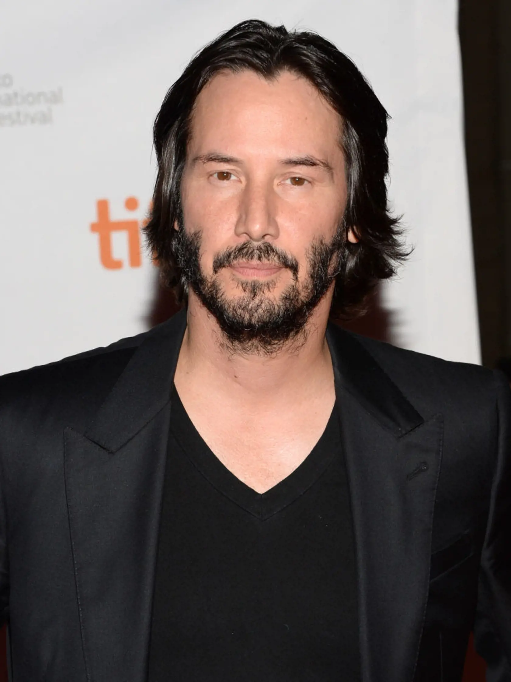 TORONTO, ON - SEPTEMBER 10:  Actor and Director Keanu Reeves arrives at the "Man Of Tai Chi" Premiere during the 2013 Toronto International Film Festival at Ryerson Theatre on September 10, 2013 in Toronto, Canada.  (Photo by Jason Kempin/Getty Images)