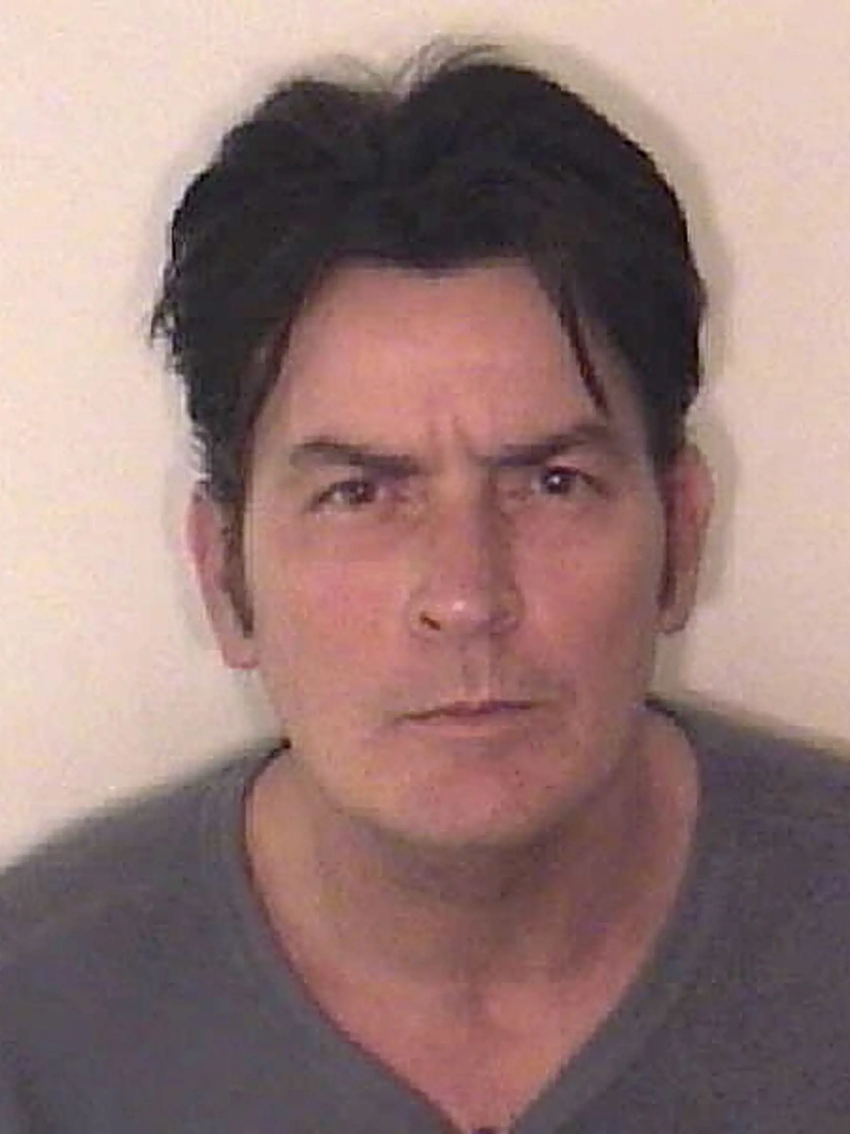 ASPEN, CO - DECEMBER 25: In this handout photo provided by the Aspen Police Department, Charlie Sheen is pictured after being arrested on December 25, 2009 in Aspen, Colorado. According to the Aspen Police Department, Sheen is being held at the Pitkin County Jail, charged with second degree assault, menacing and criminal mischief. (Photo by Aspen Police Department via Getty Images)