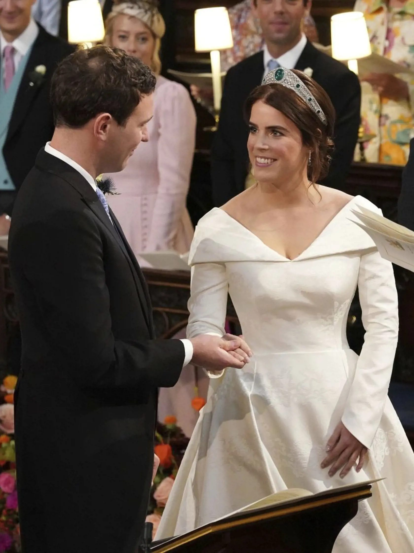 The Rt Revd David Conner, Dean of Windsor conducts the wedding ceremony between Princess Eugenie of York and Jack Brooksbank in St Georgeâs Chapel, Windsor Castle, near London, England, Friday Oct. 12, 2018. (Jonathan Brady, Pool via AP)