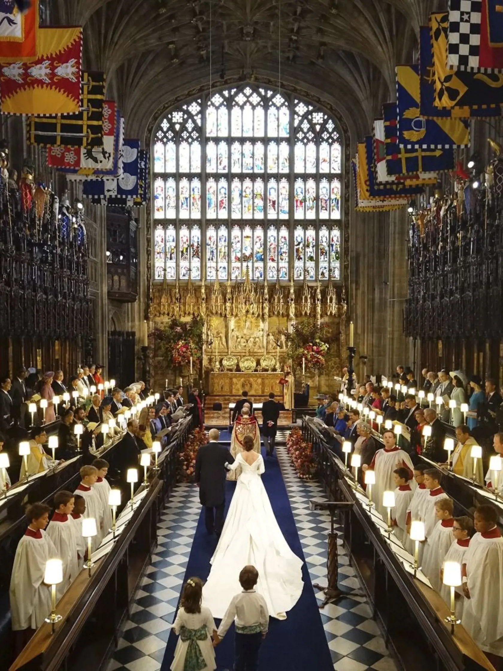 The Rt Revd David Conner, Dean of Windsor conducts the wedding ceremony between Princess Eugenie of York and Jack Brooksbank in St Georgeâs Chapel, Windsor Castle, near London, England, Friday Oct. 12, 2018. (Jonathan Brady, Pool via AP)