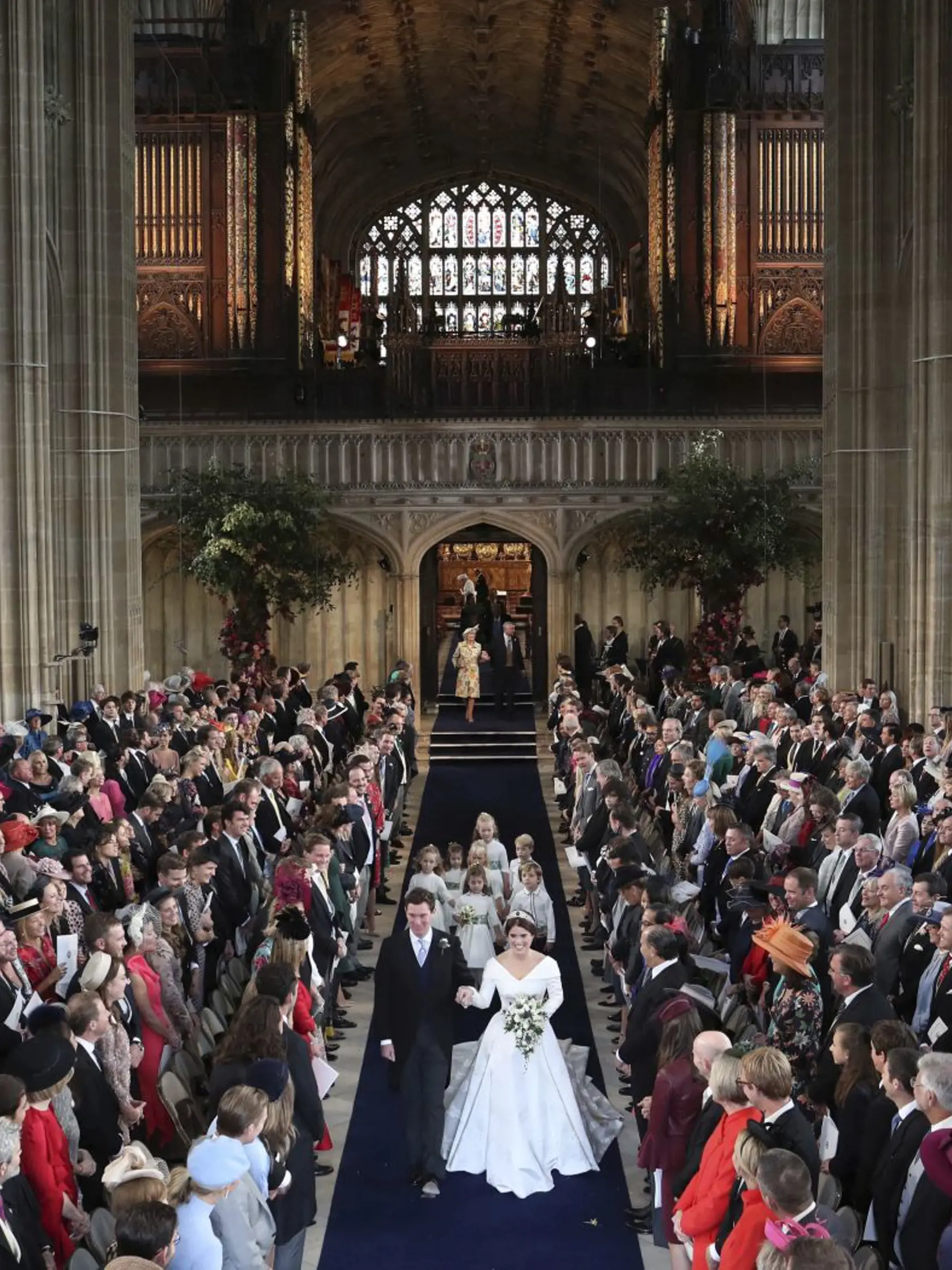 Princess Eugenie and Jack Brooksbank walk down the aisle after they were married in St Georgeâs Chapel, Windsor Castle, near London, England, Friday Oct. 12, 2018. (Danny Lawson, Pool via AP)