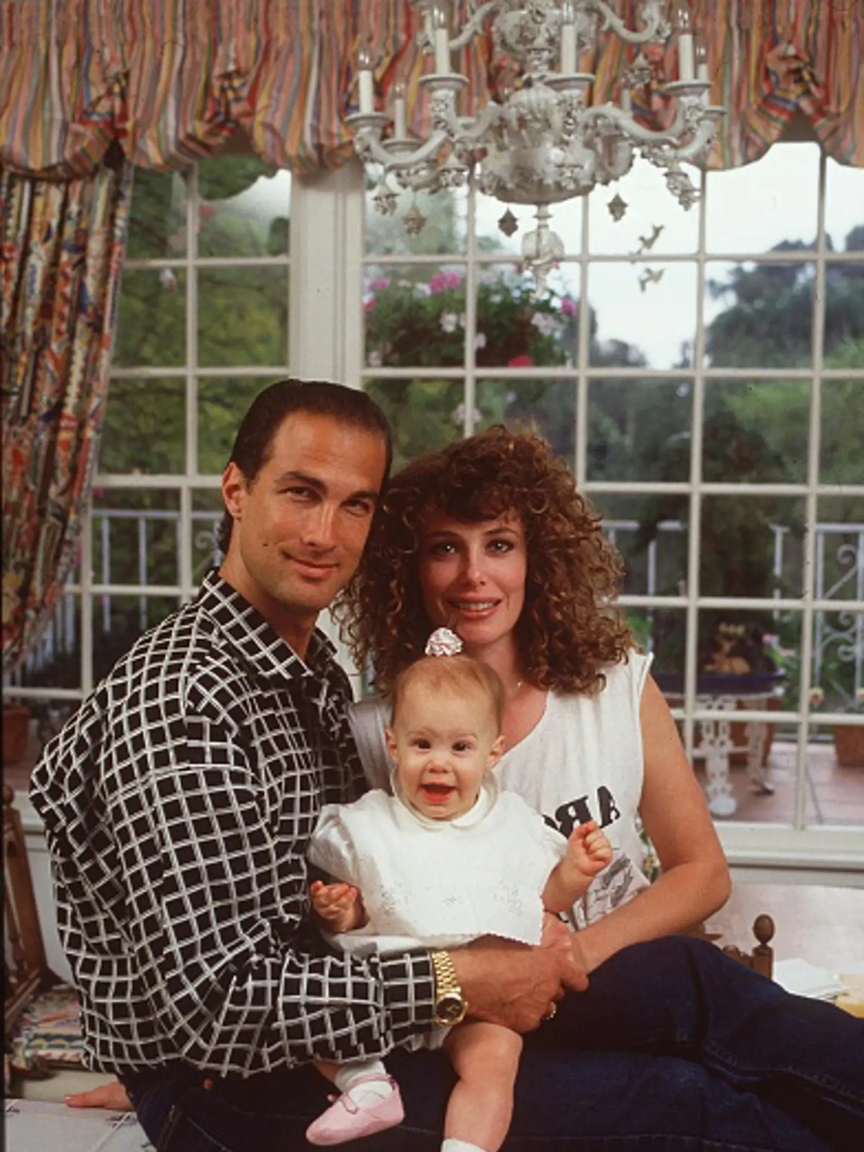 BEVERLY HILLS, CA - APRIL 13: Steven Seagal and his wife, actress/supermodel Kelly LeBrock at home when they where married and had their first child.  They divorced in 1994. April 13, 1989 Beverly Hills, California  ( Photo by Paul Harris/Getty Images )