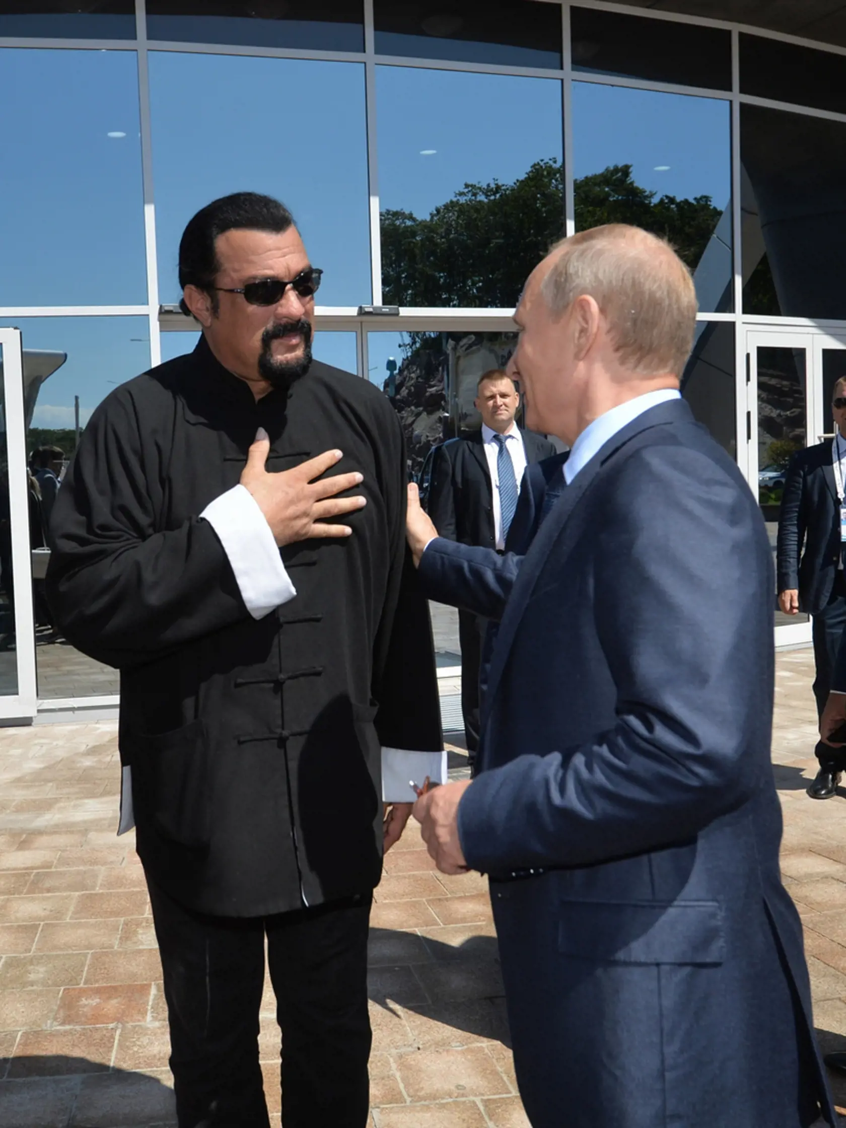 FILE - In this Sept. 4, 2015, file photo, Russian President Vladimir Putin, right, speaks with U.S. actor Steven Seagal in the Russian Far Eastern port of Vladivostok. Russian President Vladimir Putin has awarded Russian citizenship to action film actor Steven Seagal. Putin has awarded Russian citizenship to action film actor Seagal. The 64-year-old Seagal has been a regular visitor to Russia in recent years and has accompanied Putin to several martial arts events, as well as vocally defending t