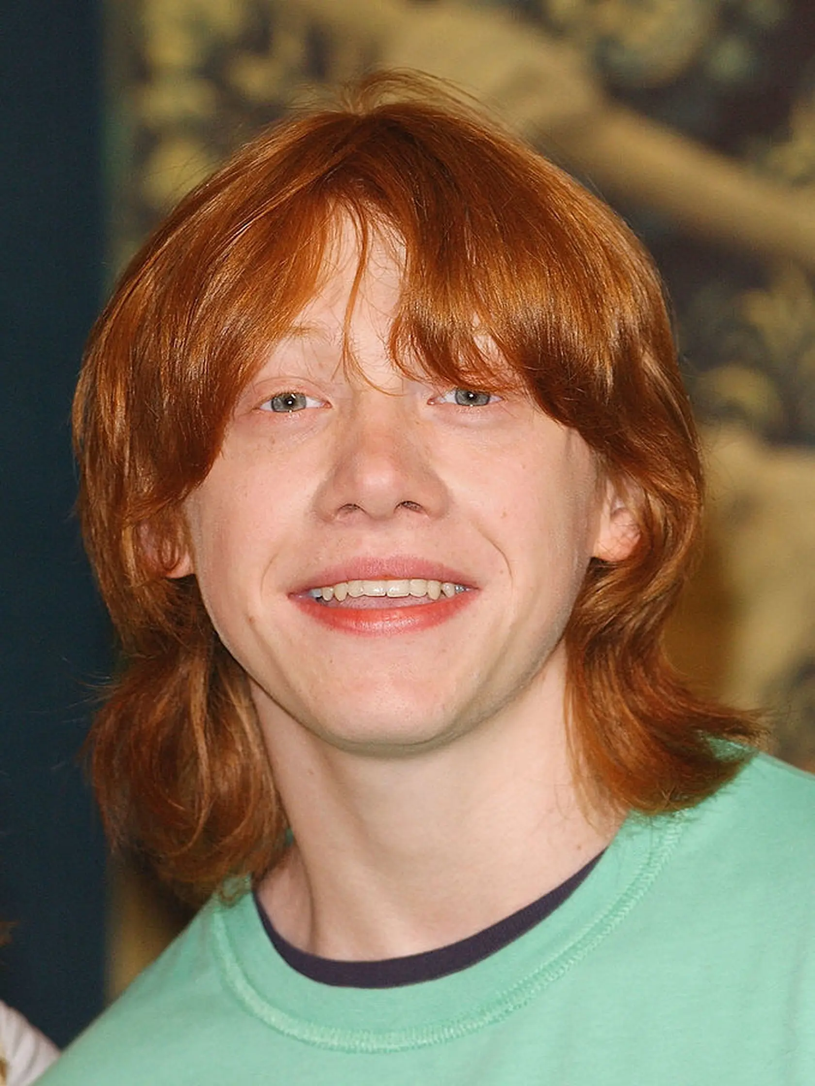 Rupert Grint si vo filmoch zahral Rona Weasleyho.