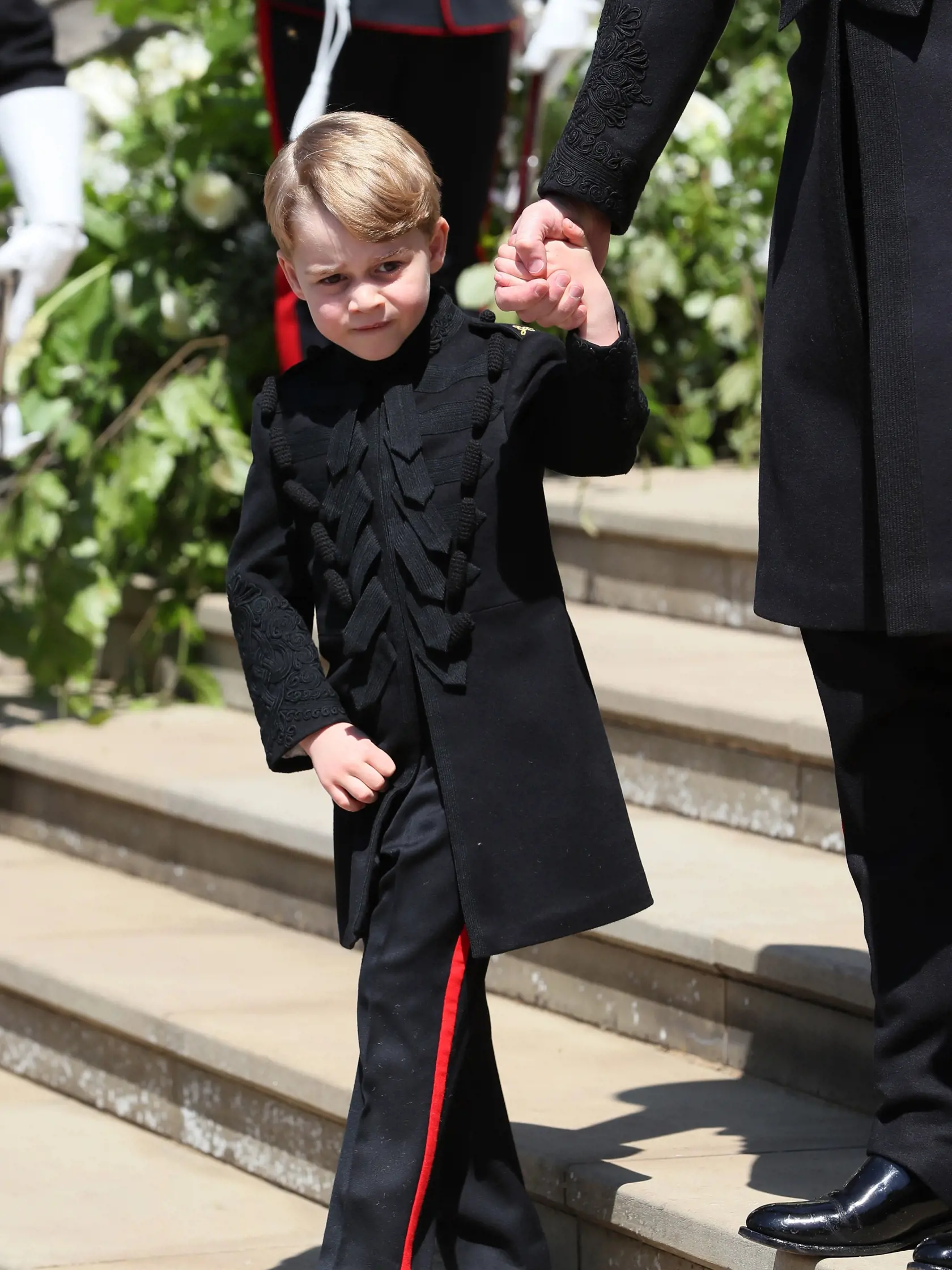WINDSOR, UNITED KINGDOM - MAY 19:  Prince George leaves St George's Chapel at Windsor Castle after the wedding of Prince Harry, Duke of Sussex and Meghan Markle on May 19, 2018 in Windsor, England. (Photo by Brian Lawless - WPA Pool/Getty Images)