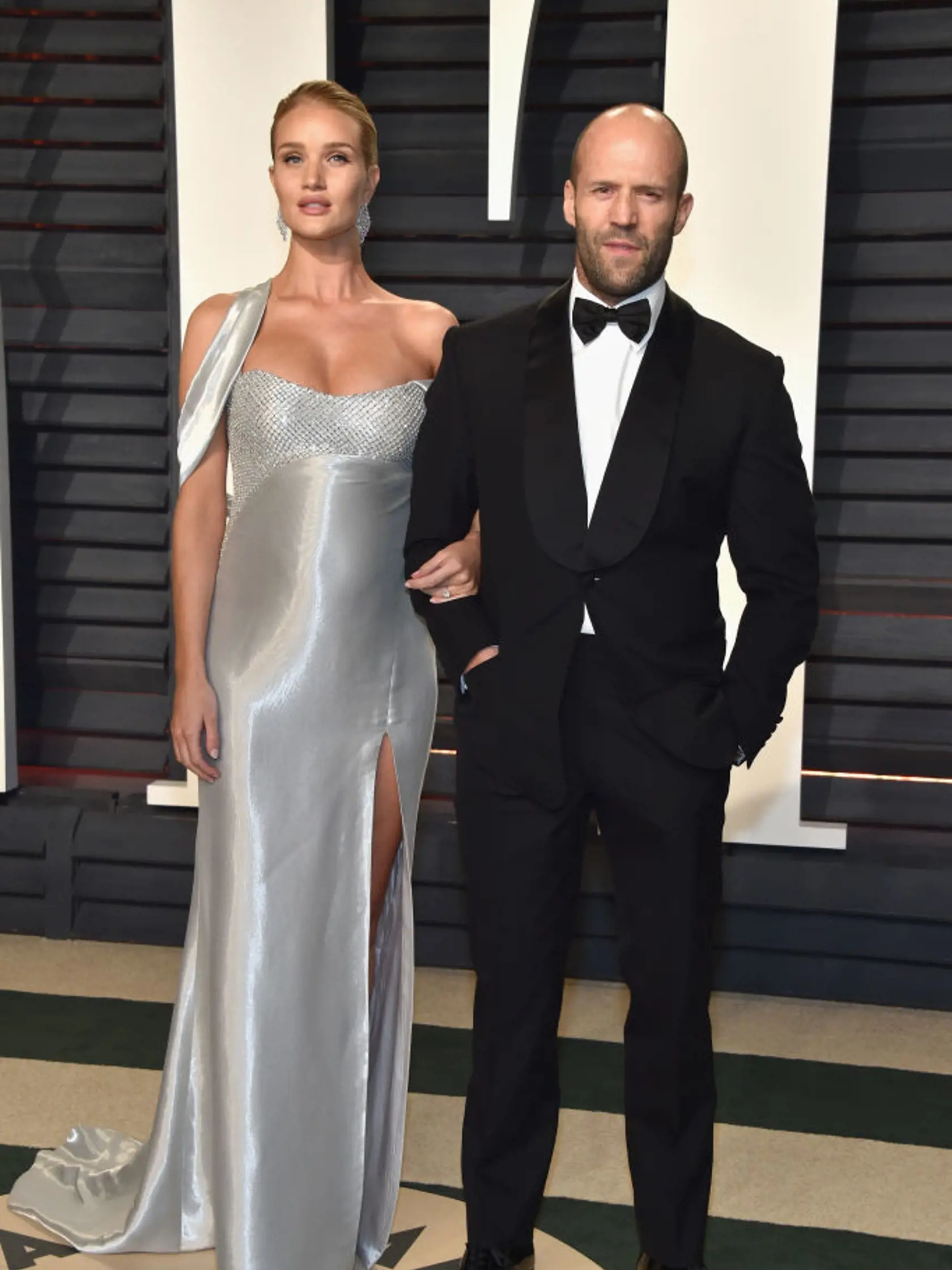 BEVERLY HILLS, CA - FEBRUARY 26:  Model-actor Rosie Huntington-Whiteley (L) and actor Jason Statham attend the 2017 Vanity Fair Oscar Party hosted by Graydon Carter at Wallis Annenberg Center for the Performing Arts on February 26, 2017 in Beverly Hills, California.  (Photo by Pascal Le Segretain/Getty Images)