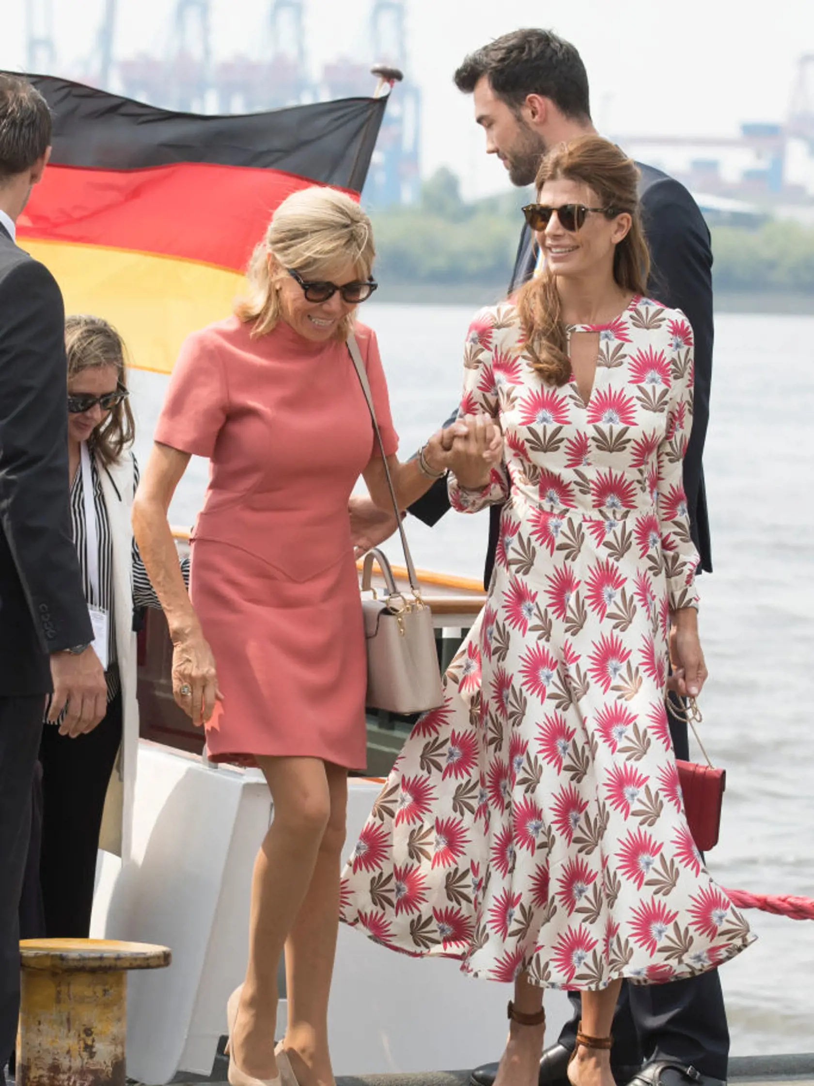 HAMBURG, GERMANY - JULY 07: Brigitte Macron, wife of Emmanuel Macron, President of France, and Juliana Awada, wife of Mauricio Macri, Presidentof Argentina, leave the boat "Diplomat" on the river Elbe as they take part in the G20 Summit Spouse Programme on July 7, 2017 in Hamburg, Germany. Leaders of the G20 group of nations are meeting for the July 7-8 summit. Topics high on the agenda for the summit include climate policy and development programs for African economies.  (Photo byJorg Sarbach -