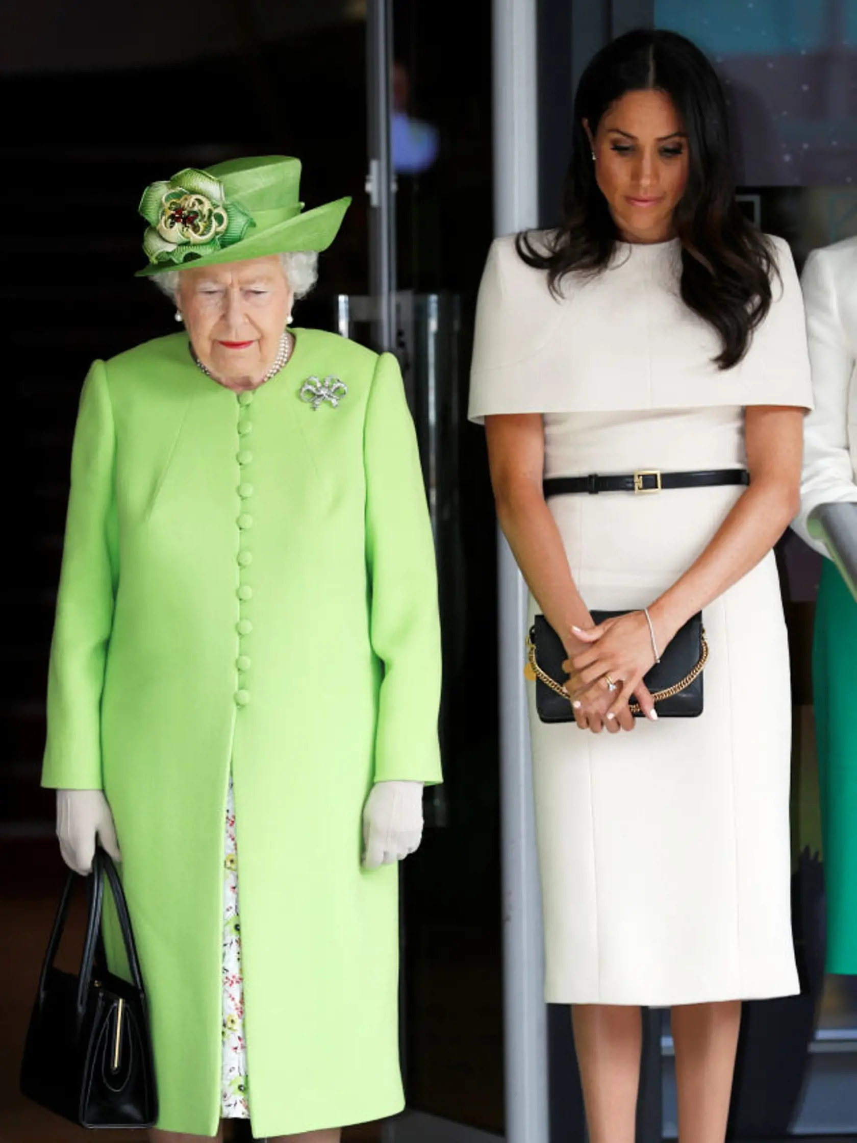 CHESTER, ENGLAND - JUNE 14:  Queen Elizabeth II and Meghan, Duchess of Sussex take a moment of silence for the victums of last year's Grenfell Tower fire as they arrive for their visit to the Storyhouse on June 14, 2018 in Chester, England. Meghan Markle married Prince Harry last month to become The Duchess of Sussex and this is her first engagement with the Queen. During the visit the pair will open a road bridge in Widnes and visit The Storyhouse and Town Hall in Chester.  (Photo by Phil Noble