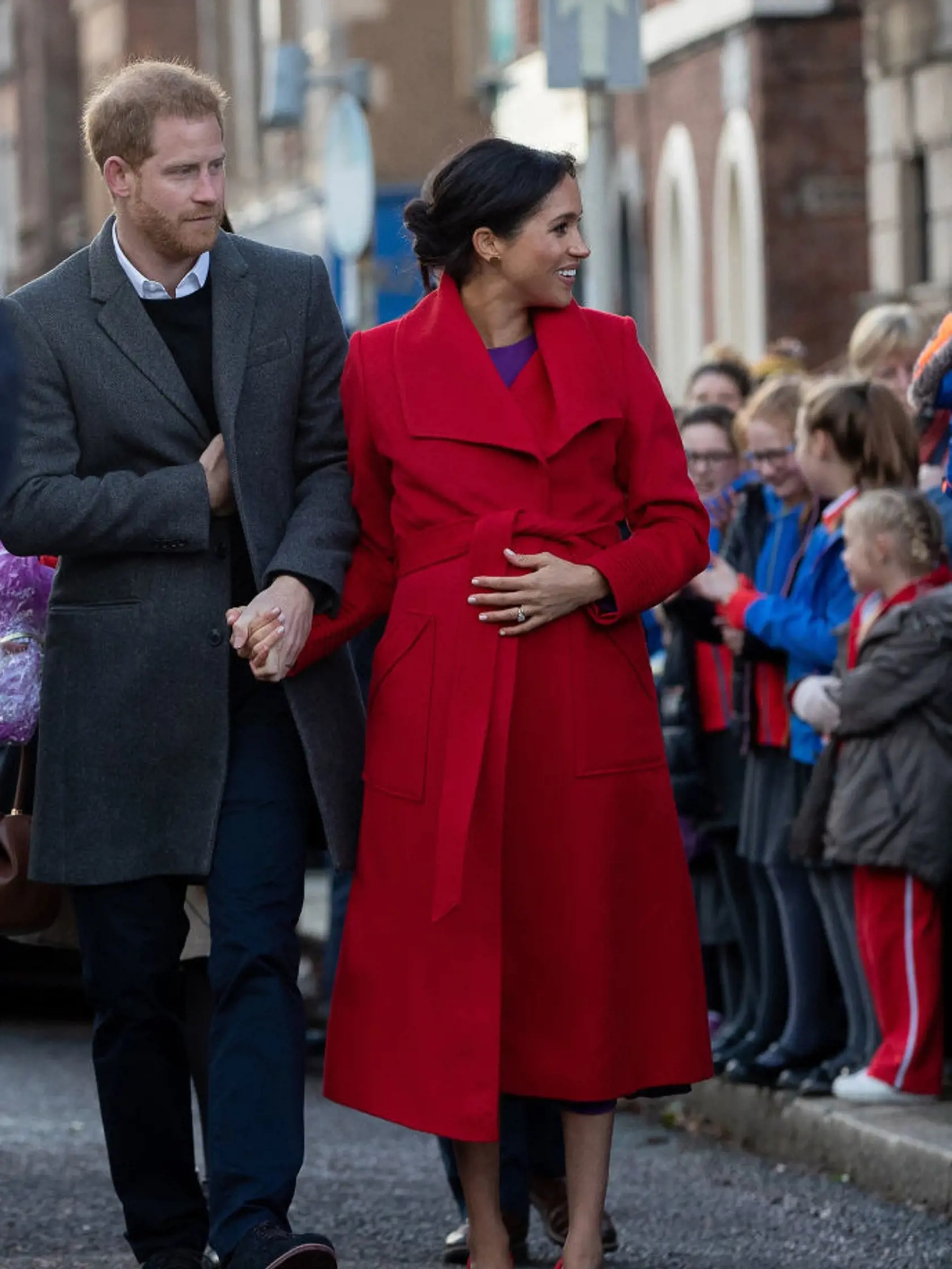 BIRKENHEAD, UNITED KINGDOM - JANUARY 14: Prince Harry, Duke of Sussex and Meghan, Duchess of Sussex greet well-wishers on Hamilton Square as they visit a new statue to mark the 100th anniversary of the death of poet Wilfred Owen, which was erected on Hamilton Square in November, during an official visit to Birkenhead on January 14, 2019 in Birkenhead, United Kingdom. (Photo by Charlotte Graham - WPA Pool/Getty Images)