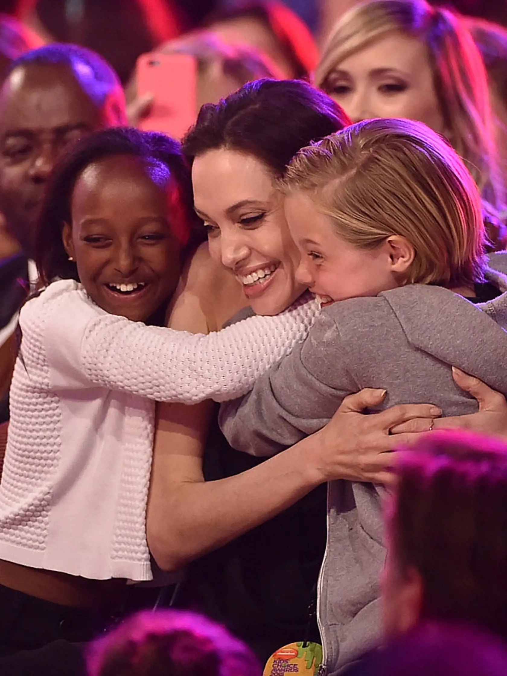 INGLEWOOD, CA - MARCH 28:  Actress Angelina Jolie hugs Zahara Marley Jolie-Pitt (L) and Shiloh Nouvel Jolie-Pitt (R) after winning award for Favorite Villain in 'Maleficent' during Nickelodeon's 28th Annual Kids' Choice Awards held at The Forum on March 28, 2015 in Inglewood, California.  (Photo by Kevin Winter/Getty Images)