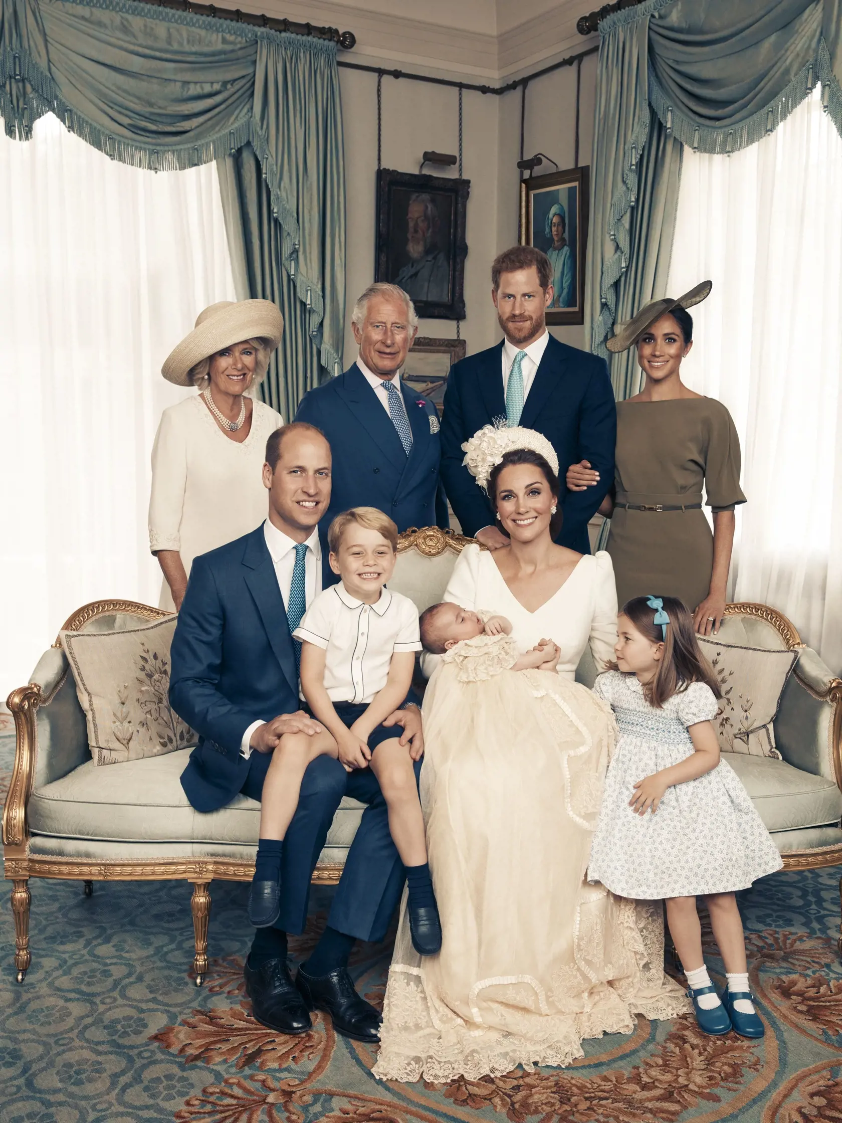 This Monday, July 9, 2018, photo provided by the Duke and Duchess of Cambridge shows an official photograph to mark the christening of Prince Louis at Clarence House, following Prince Louis' baptism, in London. Seated, left to right: Prince William, The Duke of Cambridge; Prince George; Prince Louis; Kate, the Duchess of Cambridge; and Princess Charlotte. Standing, left to right: Camilla, The Duchess of Cornwall; Prince Charles, the Prince of Wales; Prince Harry, the Duke of Sussex; and wife Meg