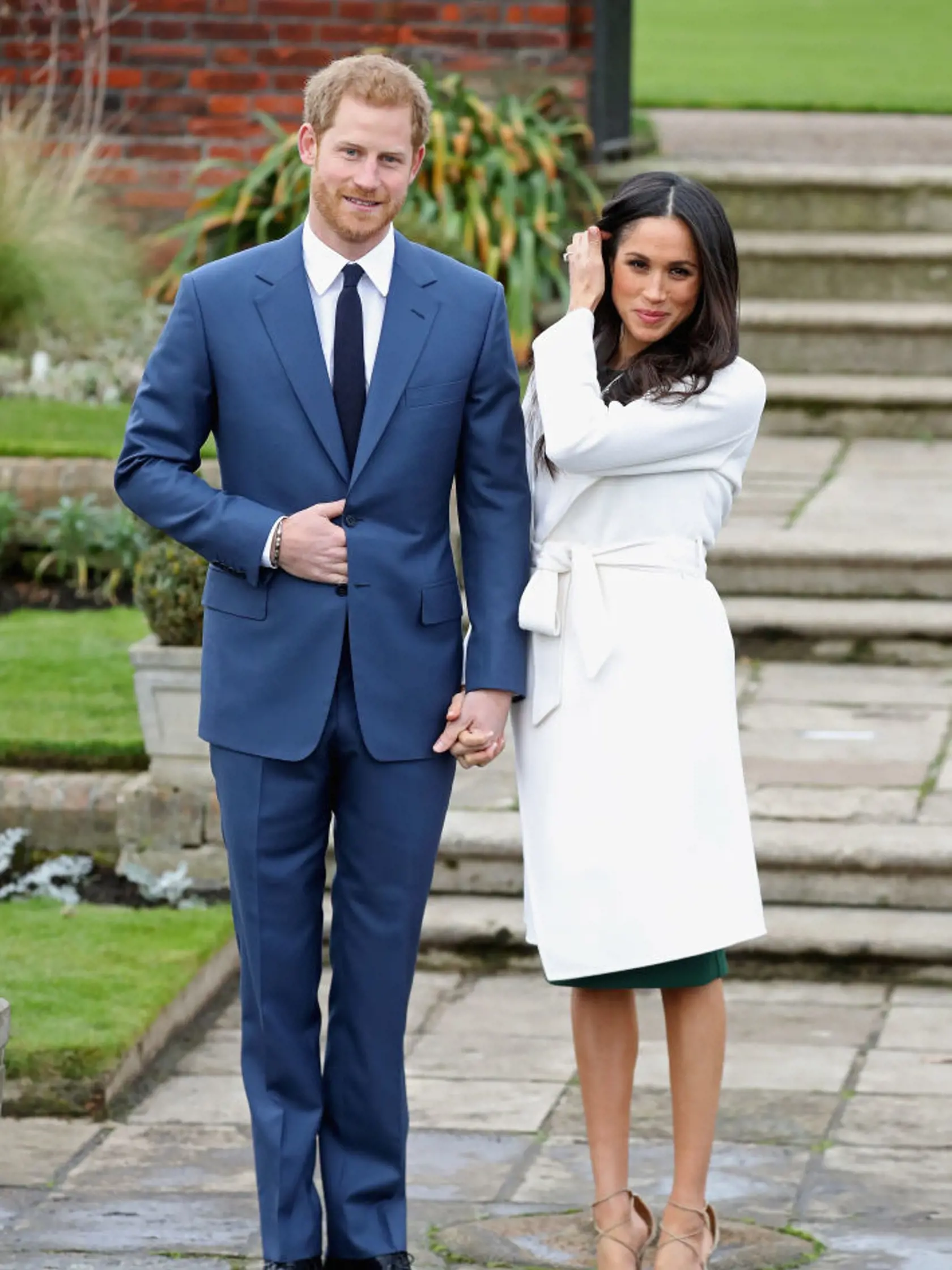 LONDON, ENGLAND - NOVEMBER 27:  Prince Harry and Meghan Markle during an official photocall to announce the engagement of Prince Harry and actress Meghan Markle at The Sunken Gardens at Kensington Palace on November 27, 2017 in London, England.  Prince Harry and Meghan Markle have been a couple officially since November 2016 and are due to marry in Spring 2018.  (Photo by Chris Jackson/Getty Images)