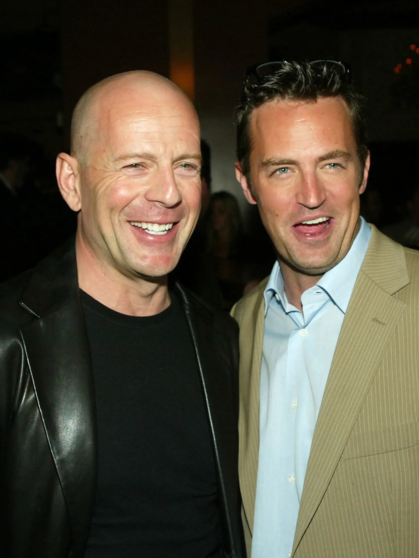 LOS ANGELES - APRIL 7:  Actors Bruce Willis (L) and Matthew Perry talk at the after-party for the premiere of Warner Bros. "The Whole Ten Yards"  at the Sunset Room on April 7, 2004 in Los Angeles, California. (Photo by Kevin Winter/Getty Images)