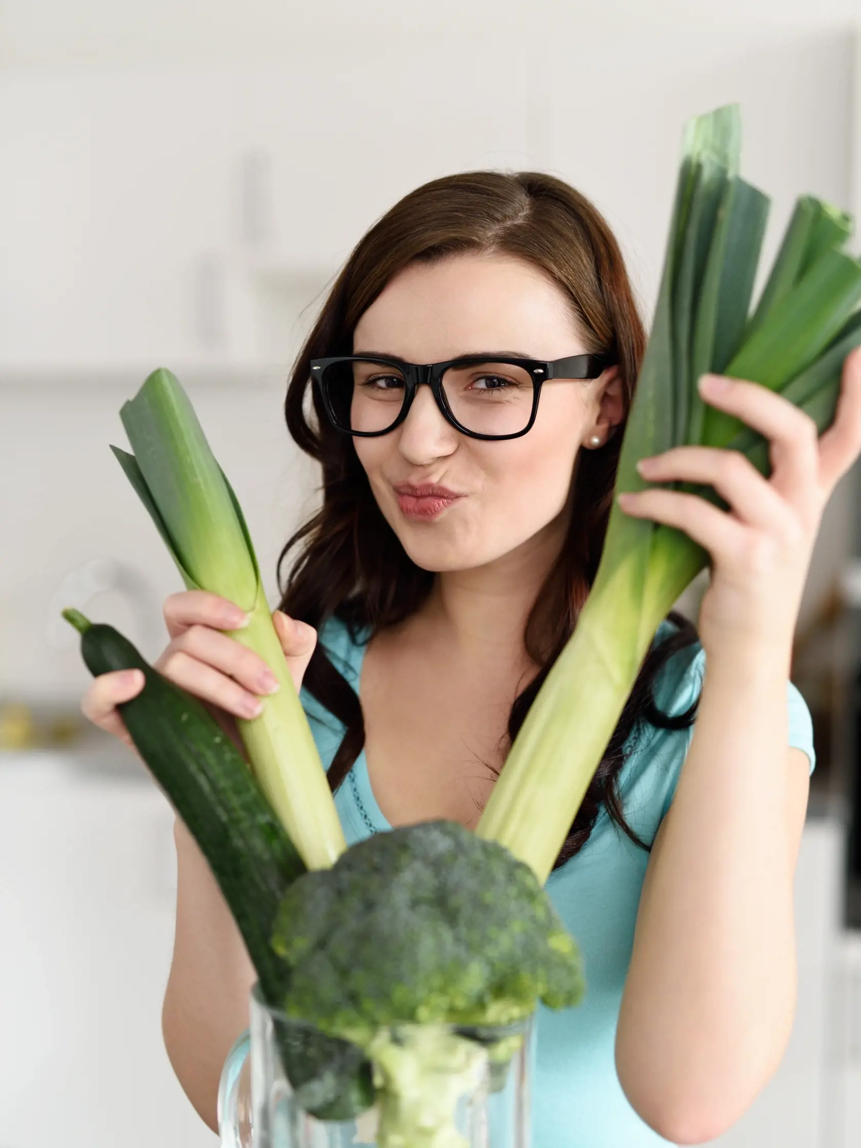 Close,Up,Pretty,Young,Woman,Wearing,Eyeglasses,Holding,Fresh,Vegetables