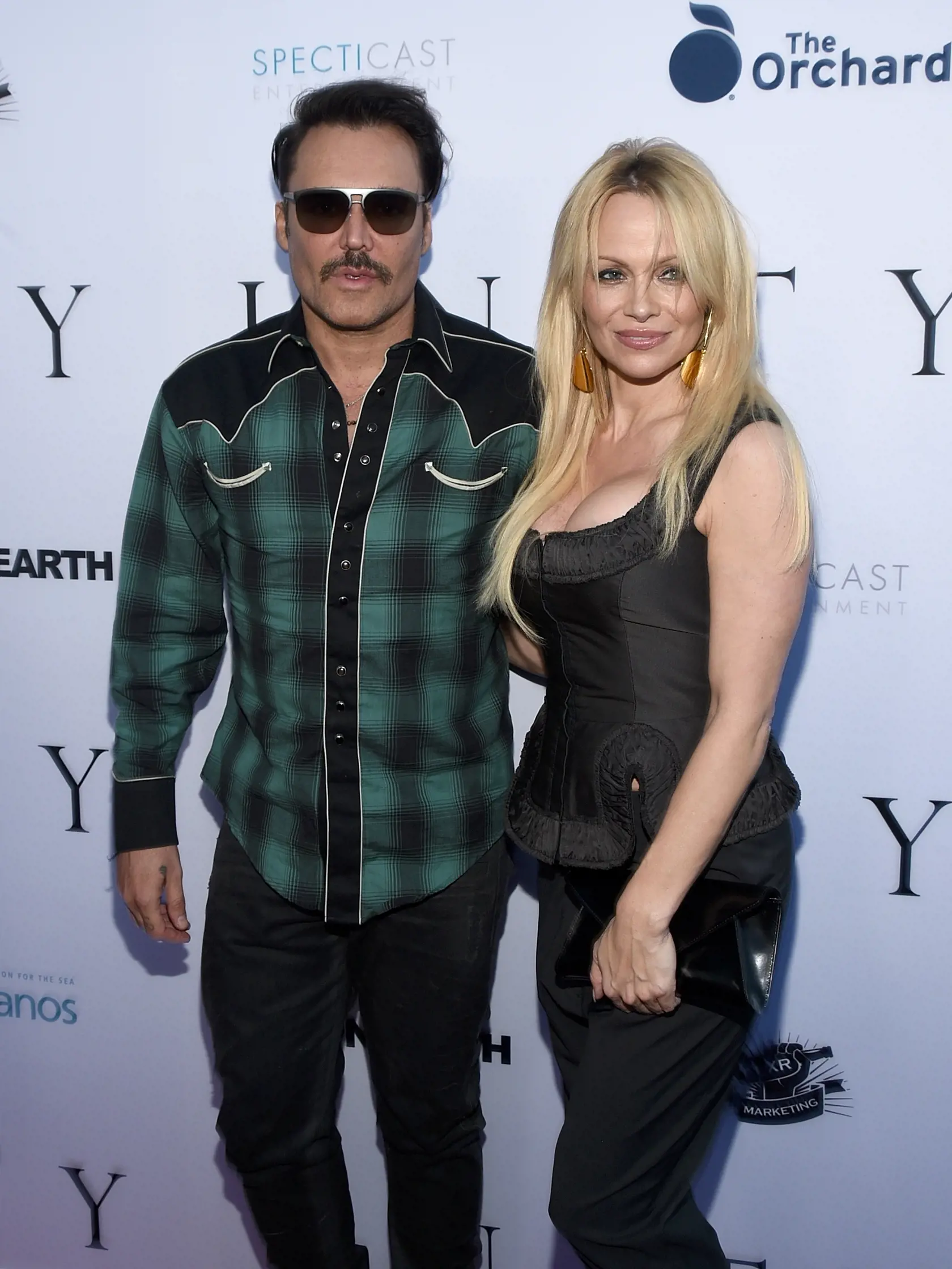 LOS ANGELES, CA - JUNE 24:  Photographer David LaChapelle (L) and actress Pamela Anderson attends the world premiere of "UNITY" at the DGA Theater on June 24, 2015 in Los Angeles, California.  (Photo by Michael Buckner/Getty Images for Specticast)