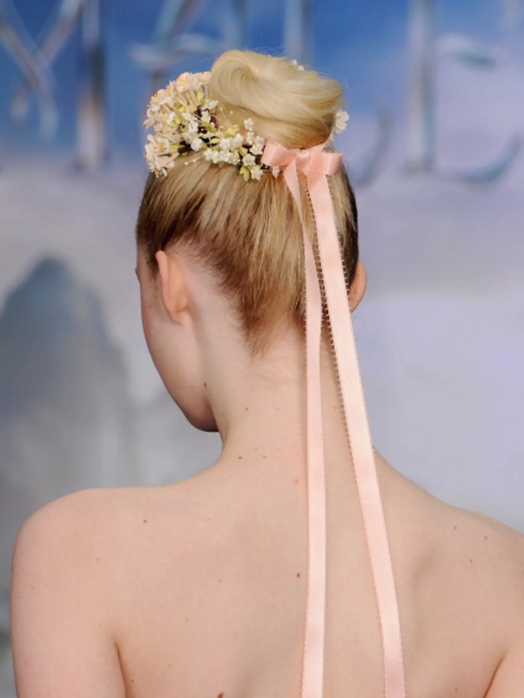 LONDON, ENGLAND - MAY 08:  Elle Fanning (Hair detail) attends a private reception as costumes and props from Disney's "Maleficent" are exhibited in support of Great Ormond Street Hospital at Kensington Palace on May 8, 2014 in London, England.  (Photo by Eamonn M. McCormack/Getty Images)