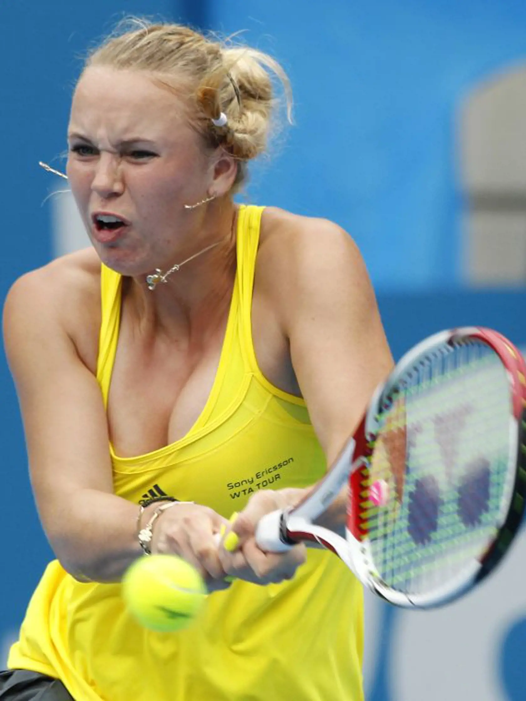 Caroline Wozniacki of Denmark plays a shot in her match against  Dominika Cibulkova of Slovakia during the Sydney International Tennis Tournament  in Sydney, Australia, Tuesday, Jan. 11, 2011. (AP Photo/Rob Griffith)