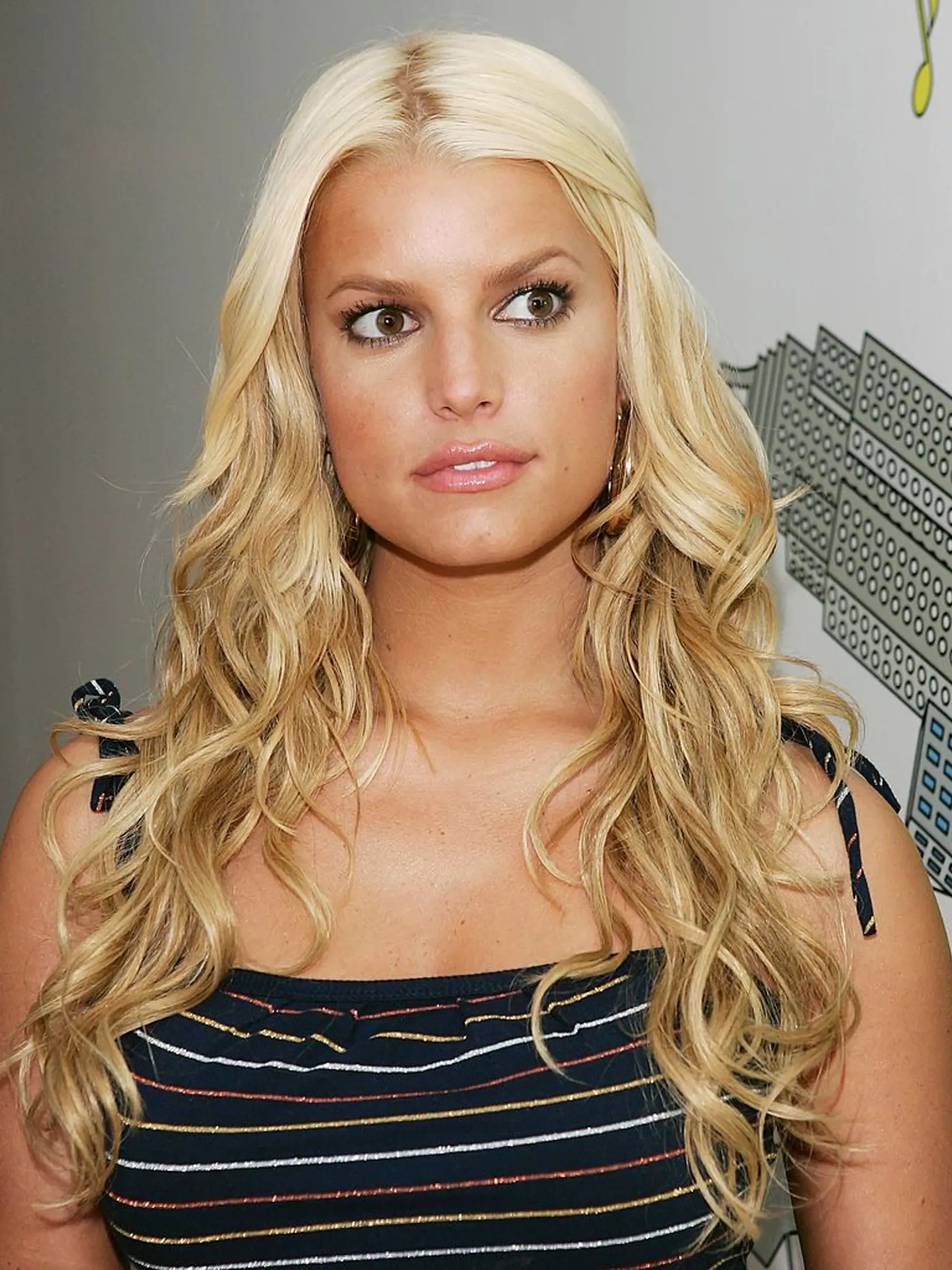 NEW YORK - JULY 19:  (U.S. TABLOIDS OUT) Singer/actress Jessica Simpson poses backstage after an appearance on MTV's Total Request Live July 19, 2006 in New York City.  (Photo by Evan Agostini/Getty Images)