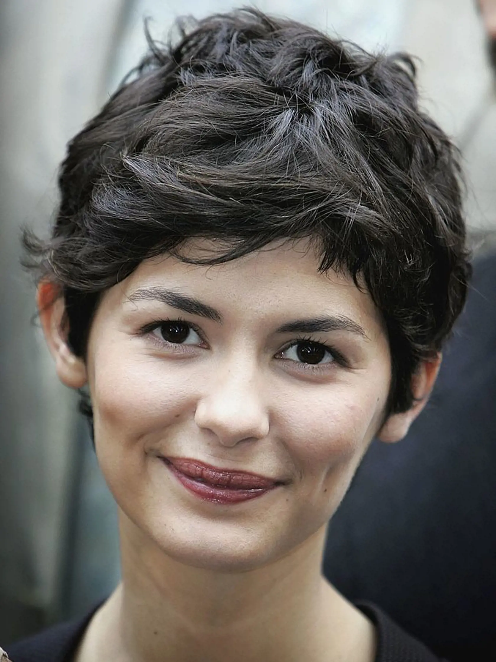LONDON - MAY 16:  Actress Audrey Tautou smiles during a photocall for new film The Da Vinci Code at Eurostar's Waterloo International Terminal on May 16, 2006 in London, England. At the photocall a new Eurostar Train was named 'The Da Vinci Code' and it is attempting a new world record for the longest international non-stop journey with the cast of the film on Board. It will arrive in Cannes for the Premiere of the film.  (Photo by Chris Jackson/Getty Images)