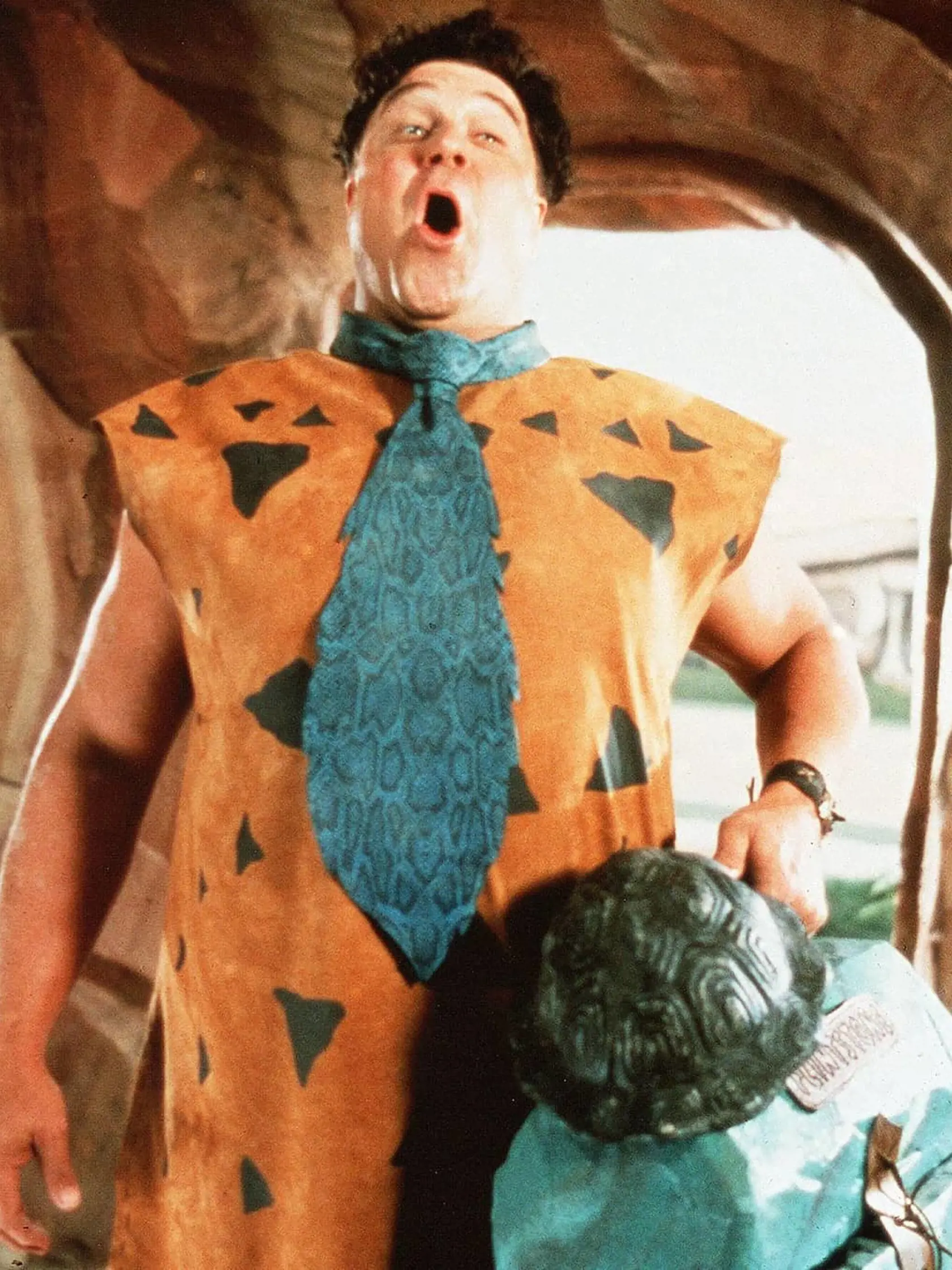 John Goodman ako Fred Flinstone.