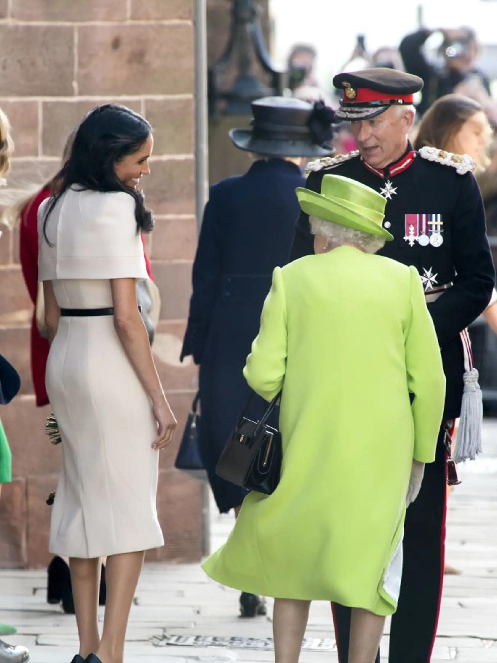 CHESTER, ENGLAND - JUNE 14:  Meghan, Duchess of Sussex and Queen Elizabeth II share a smile as they speak with the Lord Lieutenant as they leave Chester Town Hall on June 14, 2018 in Chester, England. Meghan Markle married Prince Harry last month to become Meghan, Duchess of Sussex.  This is her first engagement with the Queen. During the visit the pair opened a road bridge in Widnes, visited The Storyhouse in Chester followed by the Town Hall.  (Photo by Anthony Devlin/Getty Images)