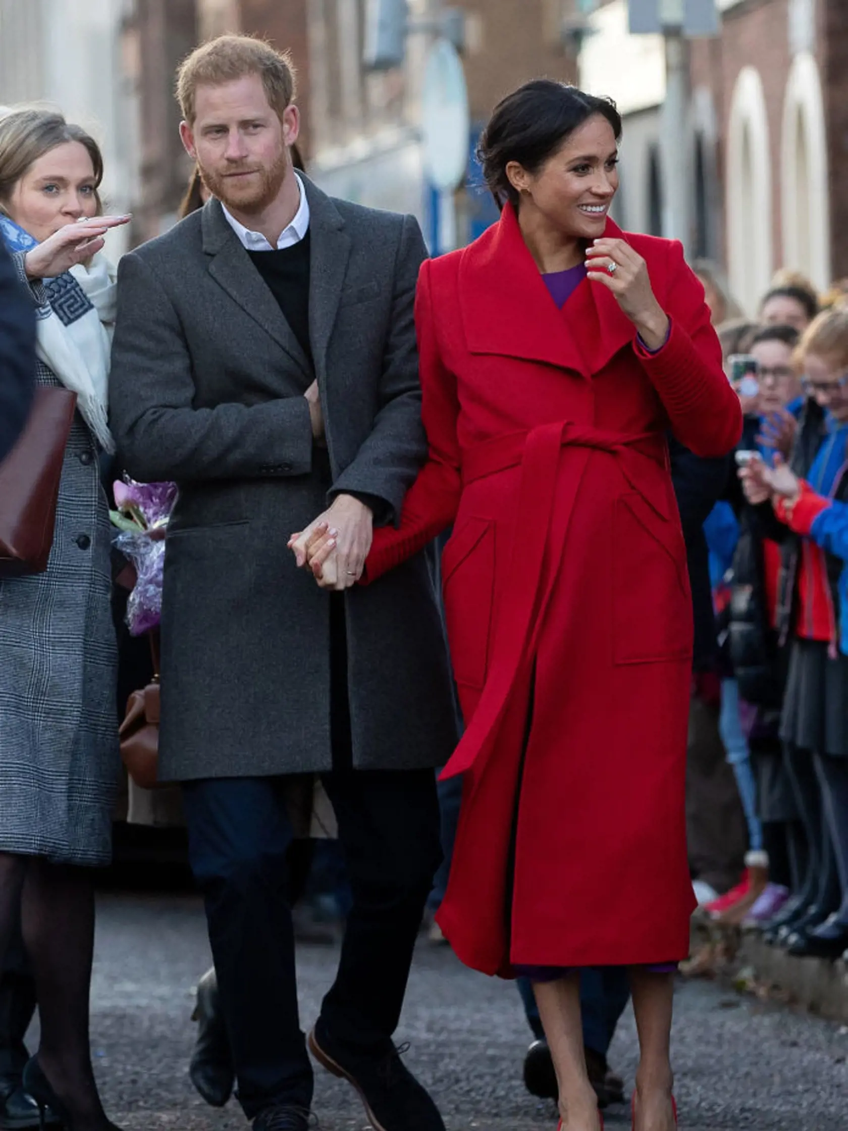 BIRKENHEAD, UNITED KINGDOM - JANUARY 14: Prince Harry, Duke of Sussex and Meghan, Duchess of Sussex greet well-wishers on Hamilton Square as they visit a new statue to mark the 100th anniversary of the death of poet Wilfred Owen, which was erected on Hamilton Square in November, during an official visit to Birkenhead on January 14, 2019 in Birkenhead, United Kingdom. (Photo by Charlotte Graham - WPA Pool/Getty Images)