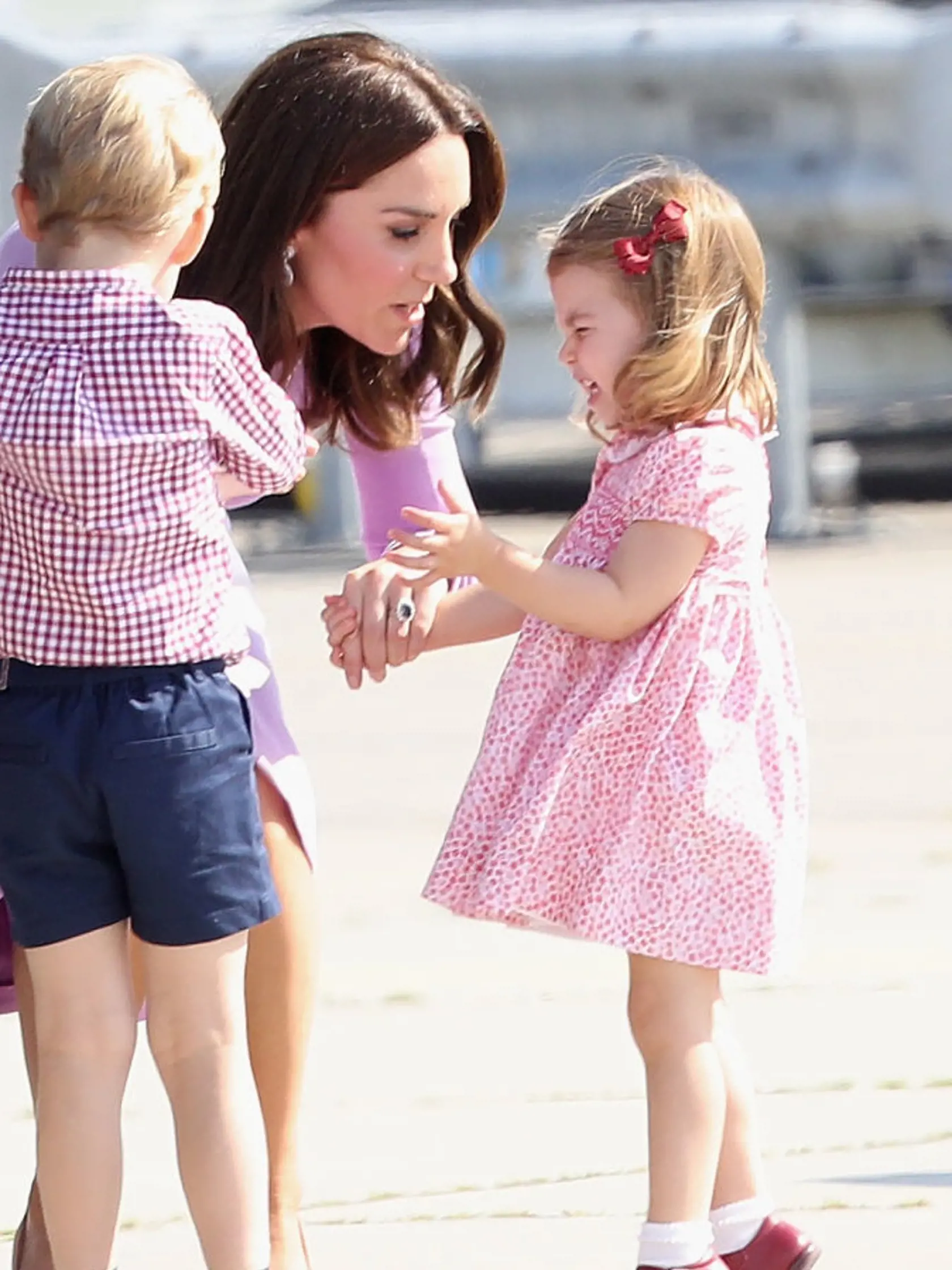 HAMBURG, GERMANY - JULY 21:  Prince William, Duke of Cambridge, Catherine, Duchess of Cambridge, Prince George of Cambridge and Princess Charlotte of Cambridge view helicopter models H145 and H135 before departing from Hamburg airport on the last day of their official visit to Poland and Germany on July 21, 2017 in Hamburg, Germany.  (Photo by Chris Jackson/Getty Images)