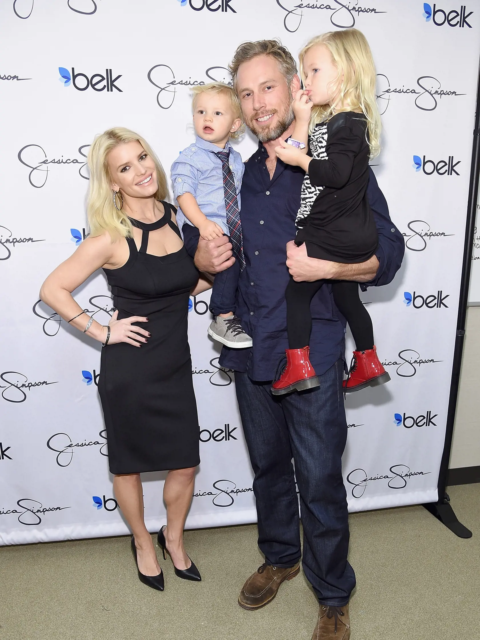 DALLAS, TX - NOVEMBER 22:  Jessica Simpson, wearing Jessica Simpson Collection, Ace Knute Johnson, Eric Johnson and Maxwell Drew Johnson, wearing Jessica Simpson Girls attend Jessica Simpson and Ashlee Simpson Ross come home for the holidays in support of the Jessica Simpson Collection and the launch of Jessica Simpson Home at Belk Galleria Dallas on November 22, 2014 in Dallas, Texas.  (Photo by Jamie McCarthy/Getty Images for Jessica Simpson Collection)