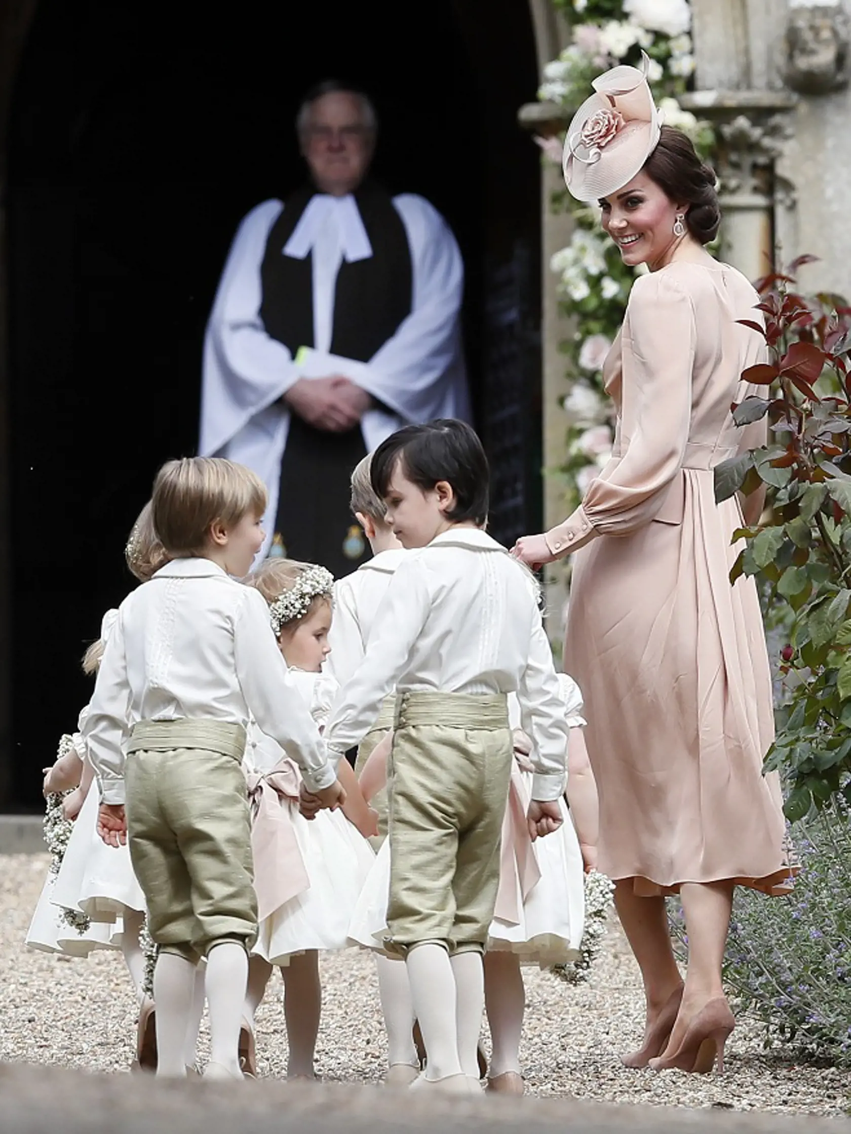 Kate, Duchess of Cambridge, right, arrives with the pageboys and flower girls for the wedding of Pippa Middleton and James Matthews at St Mark's Church in Englefield Saturday, May 20, 2017. Middleton, the sister of Kate, Duchess of Cambridge is to marry hedge fund manager James Matthews in a ceremony Saturday where her niece and nephew Prince George and Princess Charlotte are in the wedding party, along with sister Kate and princes Harry and William. (AP Photo/Kirsty Wigglesworth, Pool)