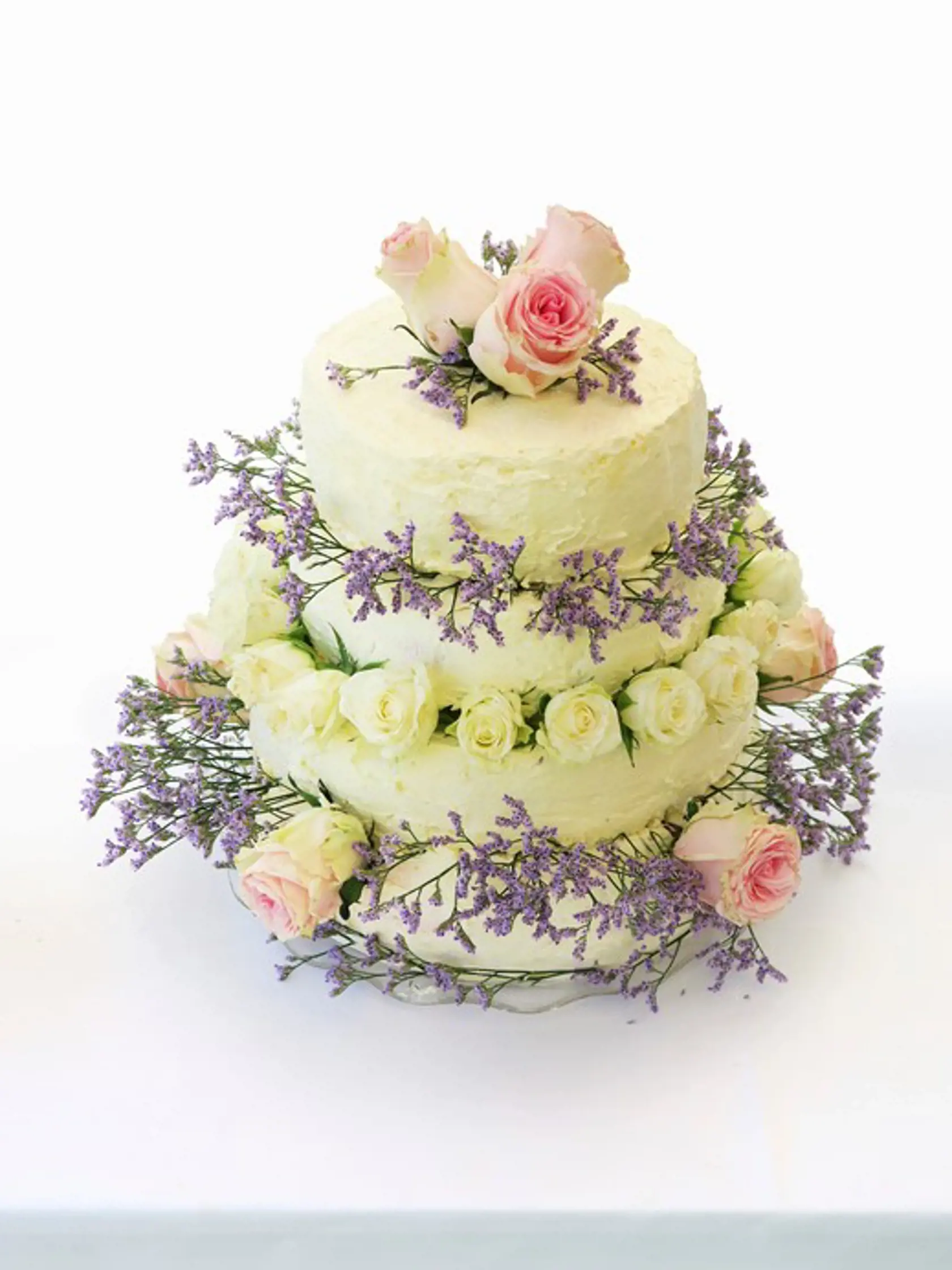 A four-tier wedding cake decorated with roses, Image: 267030414, License: Royalty-free, Restrictions: , Model Release: no, Credit line: Profimedia, FoodCollection