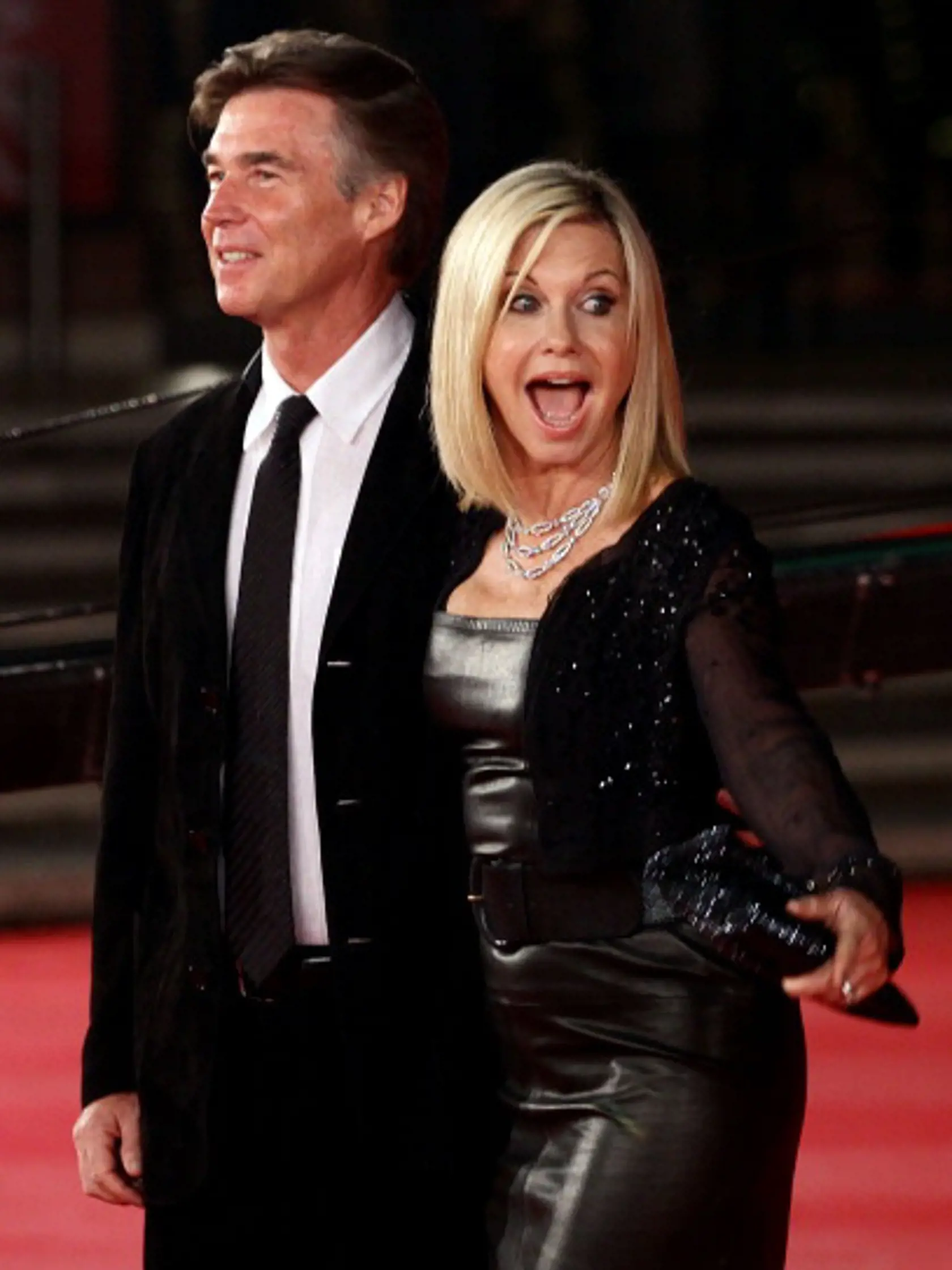 ROME, ITALY - OCTOBER 28: Actress Olivia Newton-John (R) and John Easterling attend the 'A Few Best Man' premiere during the 6th International Rome Film Festival at Auditorium Parco Della Musica on October 28, 2011 in Rome, Italy. (Photo by Vittorio Zunino Celotto/Getty Images for Lancia)