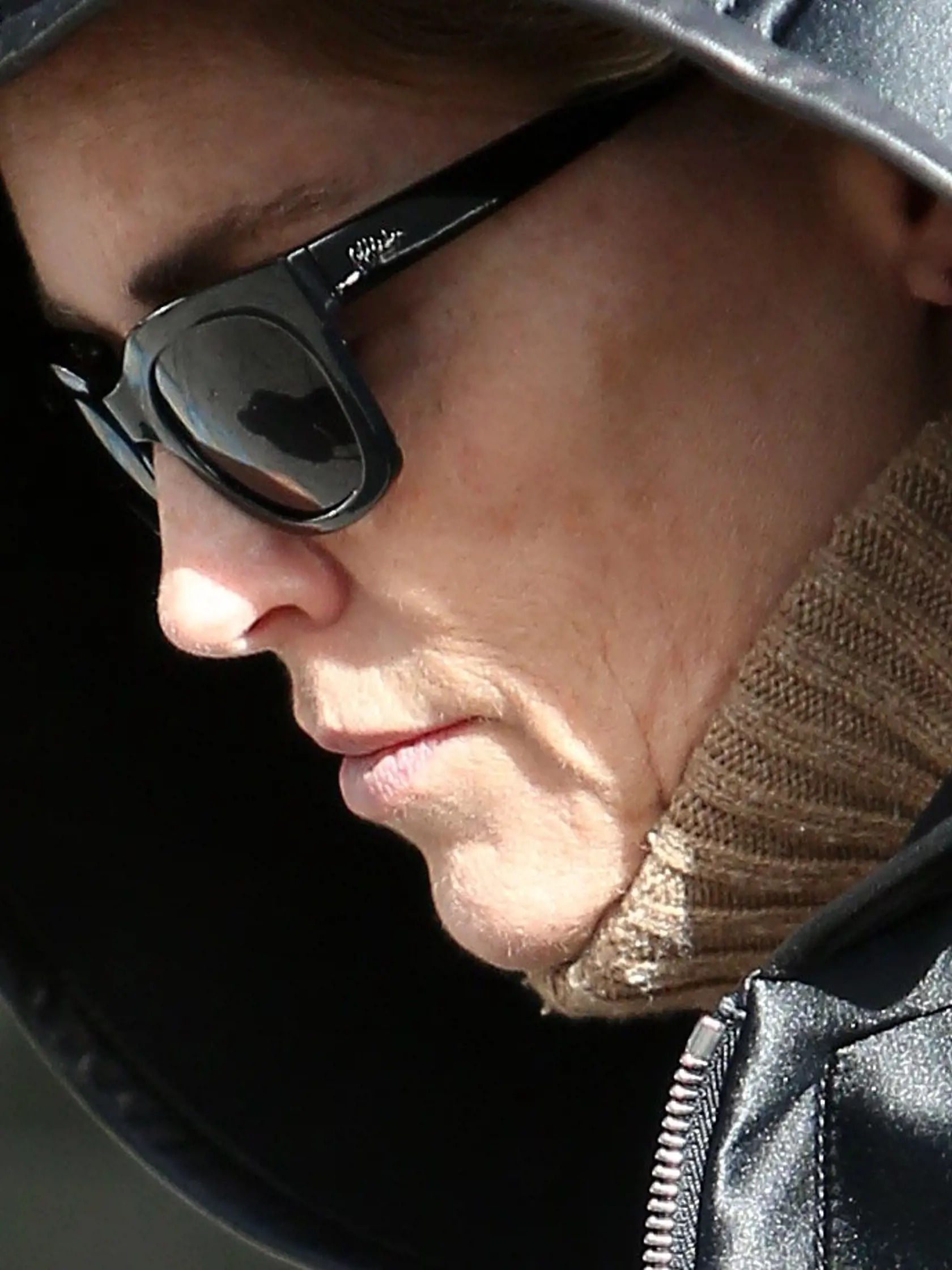 *EXCLUSIVE* Beverly Hills, CA - A make-up free, Sharon Stone, spotted leaving, XIV Karats.  The legendary actress was seen with a hooded jacket that she used to cover herself as she payed for valet with a $100 bill.          December 12, 2014, Image: 213077913, License: Rights-managed, Restrictions: NO Brazil, Model Release: no, Credit line: Profimedia, AKM-GSI