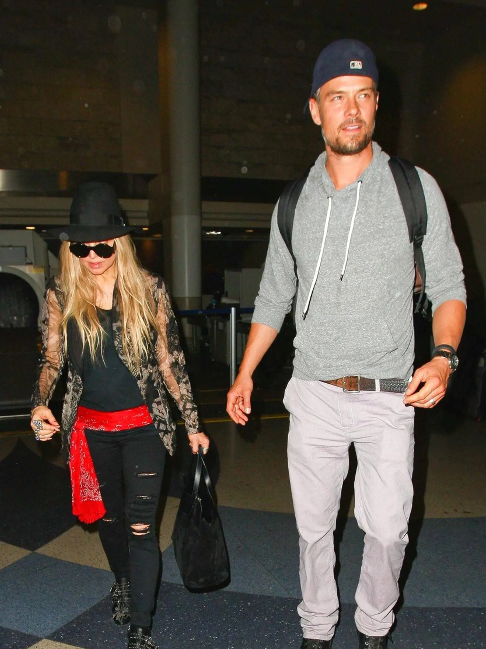 Los Angeles, CA - Fergie and Josh Duhamel arrive from a flight at LAX, the happy duo had a laugh with a funny TSA staffer that made jokes as they exited the Terminal.          June  11, 2014, Image: 196143242, License: Rights-managed, Restrictions: NO Brazil, Model Release: no, Credit line: Profimedia, AKM-GSI