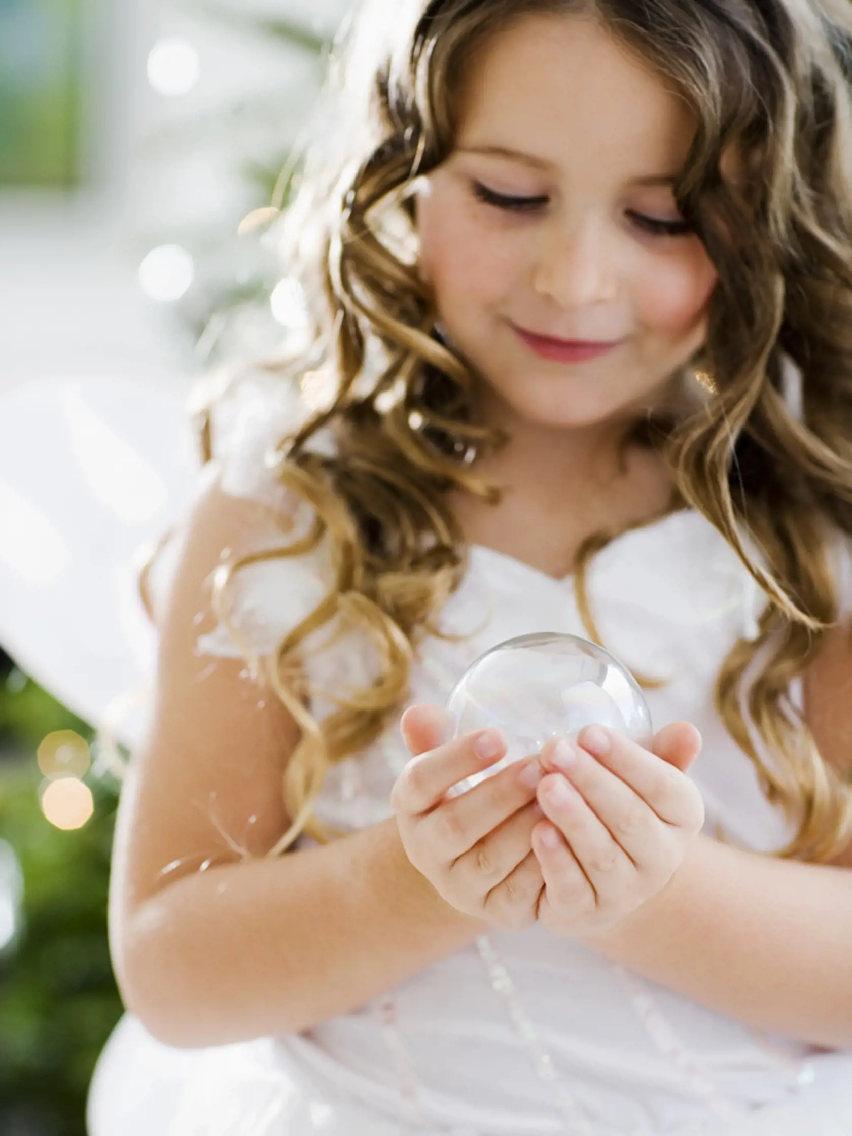 Girl holding Christmas ornament