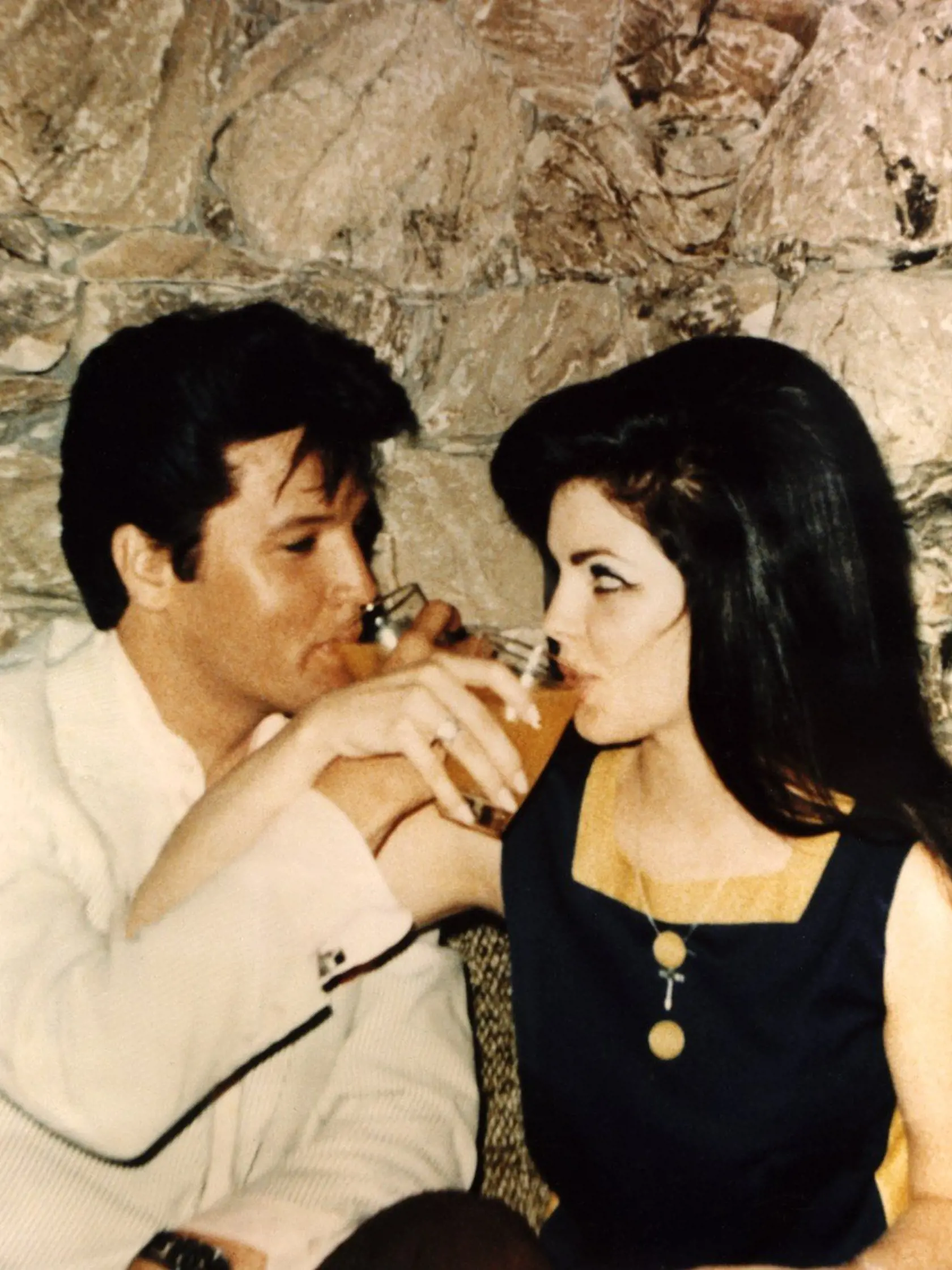Newlyweds ELVIS PRESLEY and PRISCILLA PRESLEY toast each other after the ceremony, 1967, Image: 98307707, License: Rights-managed, Restrictions: For usage credit please use; Courtesy Everett Collection, Model Release: no, Credit line: Profimedia, Everett