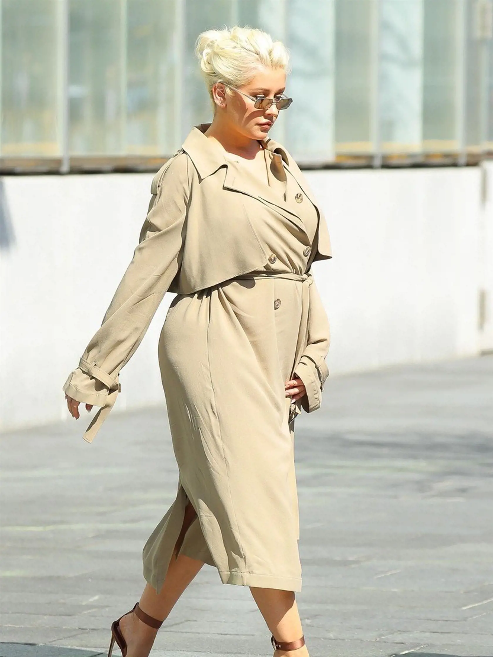 New York, NY  - *EXCLUSIVE*  - Singer Christina Aguilera looks stunning in a beige trench coat while out and about in New York. Christina is reportedly set to be making a big comeback with her new album which has a  track produced by Kanye West due to be released this week. It seems Aguilera is definitely on track to a major comeback. The singer was praised for her au natural Paper cover and for her recent appearance on carpool karaoke with James Corden.    Pictured: Christina Aguilera    BACKGR
