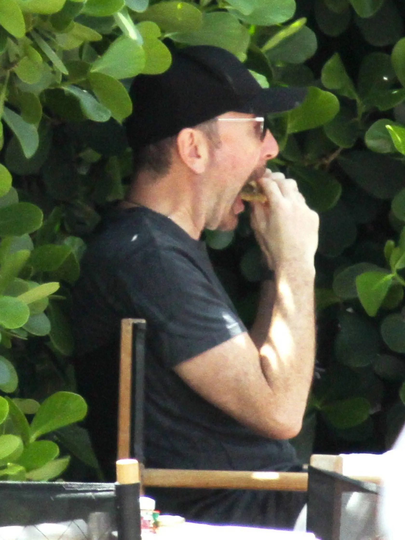 The Edge chomps on a burger poolside the day after U2's sold out South Florida concert. Miami Beach, FL. 6/30/11, Image: 96159644, License: Rights-managed, Restrictions: MAVRIXONLINE.COM - +1 305 542 9275. Fees must be agreed for image use. Daily Mail Online Out. Byline, credit, TV usage, web usage or linkback must read MAVRIXONLINE.COM. Failure to byline correctly will incur double the agreed fee., Model Release: no, Credit line: Profimedia, Mavrixphoto