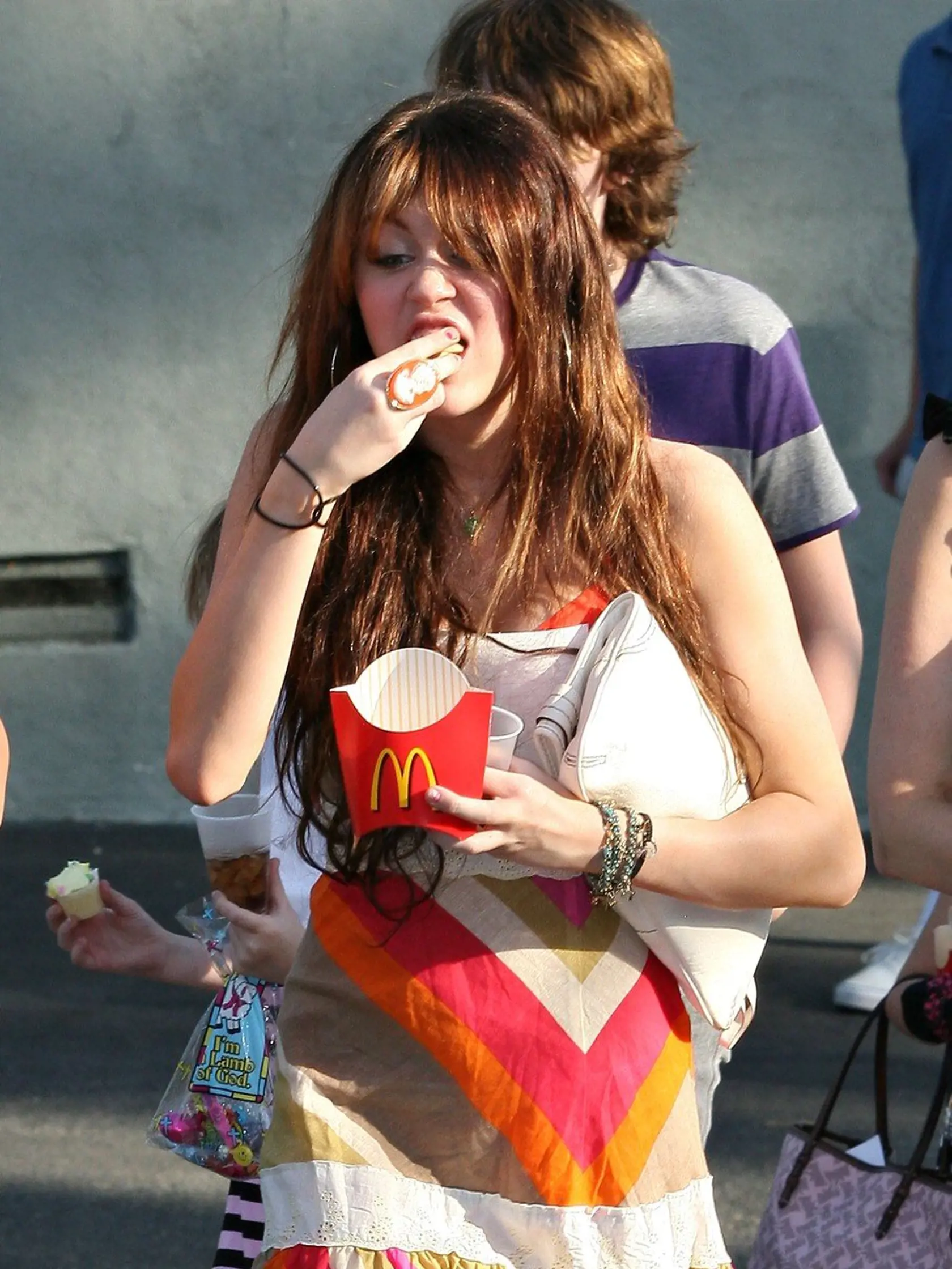 Miley Cyrus was spotted leaving her Toluca Lake church yesterday in a colorful Easter dress. Apparently during the Easter festivities the tween queen worked up and appetite because she chowed down on some McDonald's fries before even leaving the church grounds! It's a good thing Miley has the metabolism of a fifteen-year-old otherwise Hanna Montana costumers might have to start buying bigger sizes!   CR: ANON   03/22/2008 --- Miley Cyrus ---  - 310-395-0500 / Sales: 310-395-0500, Image: 24743338