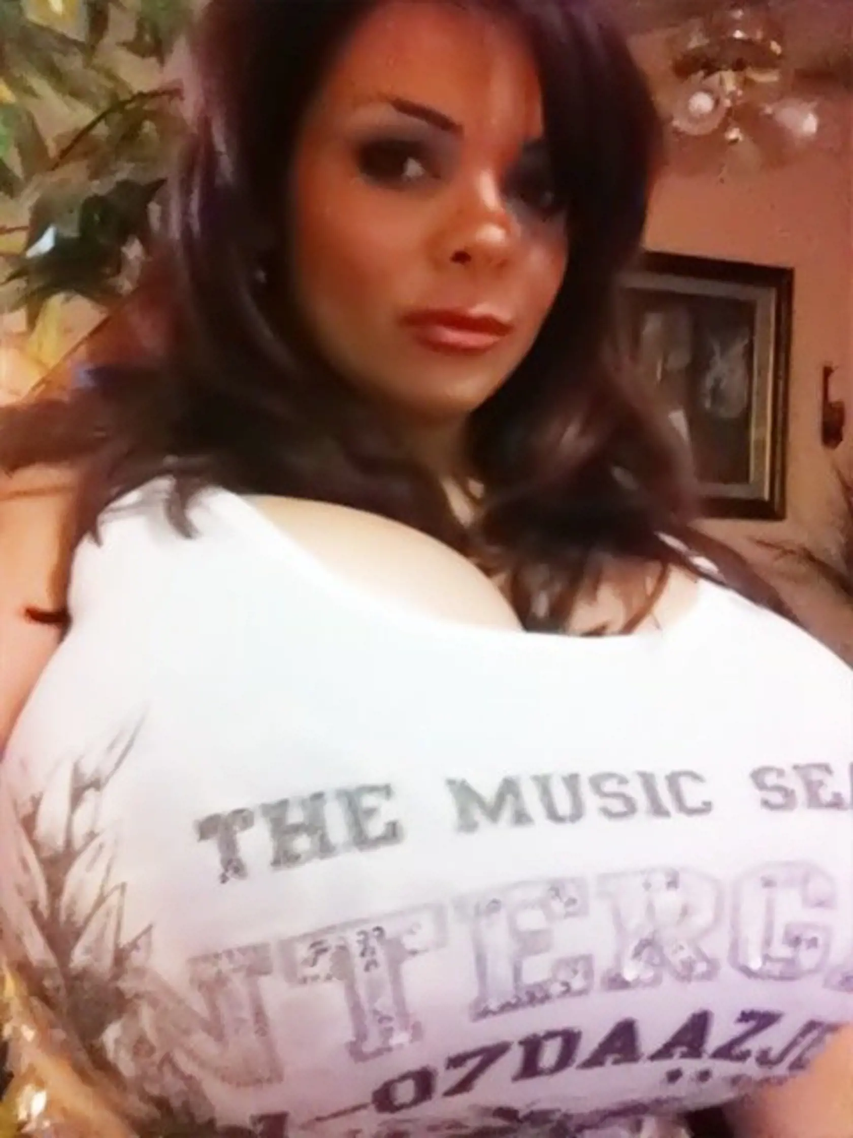 ***EXCLUSIVE*** HOUSTON, TX - 2011: Model Sheyla Hershey poses in a self-portrait at home with her 38 KKK breasts in 2011 in Houston, Texas. It is Christmas come early for big boob fans with the news that model Sheyla Hershey has re-inflated her breasts back to a whopping 38 KKK. Back on track to return to her previous size of 38 MMM, Sheyla is overjoyed with her new mammoth-mammary's-even though she lied to her husband about getting them re-done. Having lost her MMM breasts in 2010 following a 