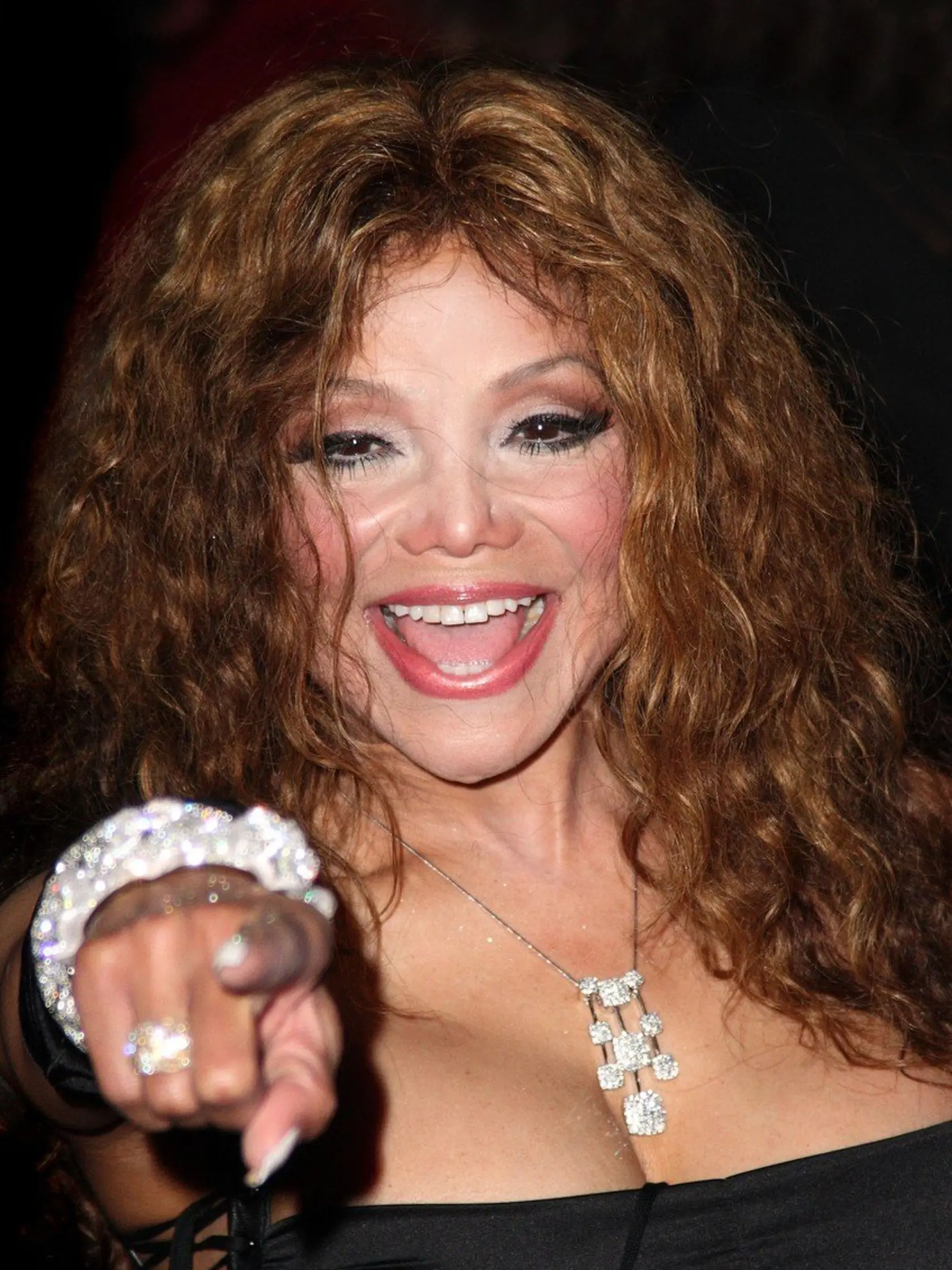 LA TOYA JACKSON Attending the UK film premiere of "The Imaginarium Of Doctor Parnassus" at the Empire Leicester Square cinema, London, England, UK, October 6th 2009. portrait headshot black Latoya hand finger gesture pointing necklace silver ring bracelets mouth open smiling cleavage, Image: 39229418, License: Rights-managed, Restrictions: , Model Release: no, Credit line: Profimedia, Capital pictures