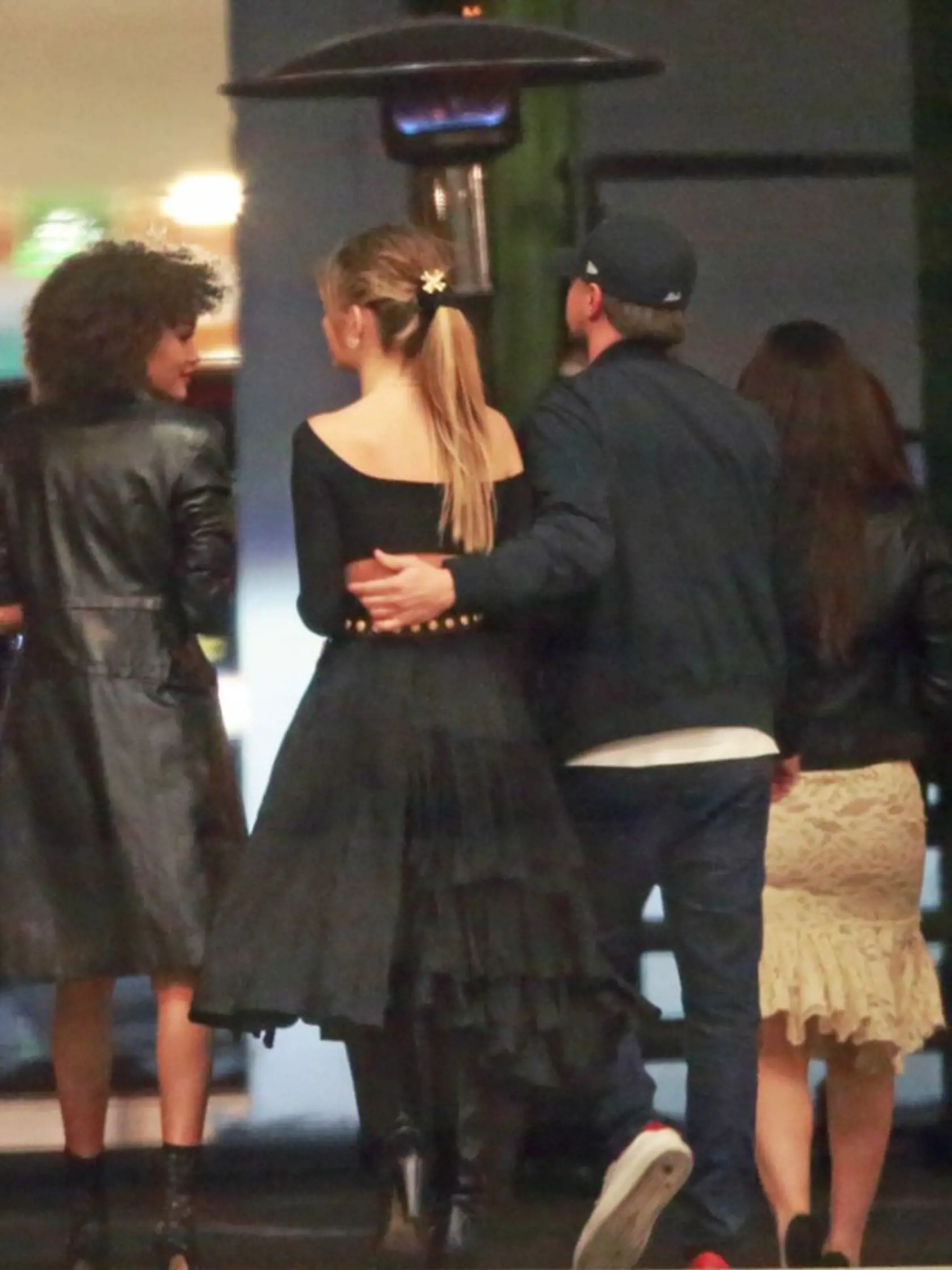 EXCLUSIVE: *NO WEB UNTIL 11PM PST, FEBRUARY 12, 2018* *NO USA PRINT* *PREMIUM EXCLUSIVE RATES APPLY* Leonardo DiCaprio attends Ellen DeGeneres' LA birthday party with model girlfriend Camila Morrone. DiCaprio, who was dressed down in a t-shirt, jeans and his trademark baseball cap, was spotted putting his arm around his 20-year-old girlfriend outside the star-studded bash at The Lot Studios in West Hollywood on Saturday February 10, 2018. DiCaprio, who split with Nina Agdal last year, was first 