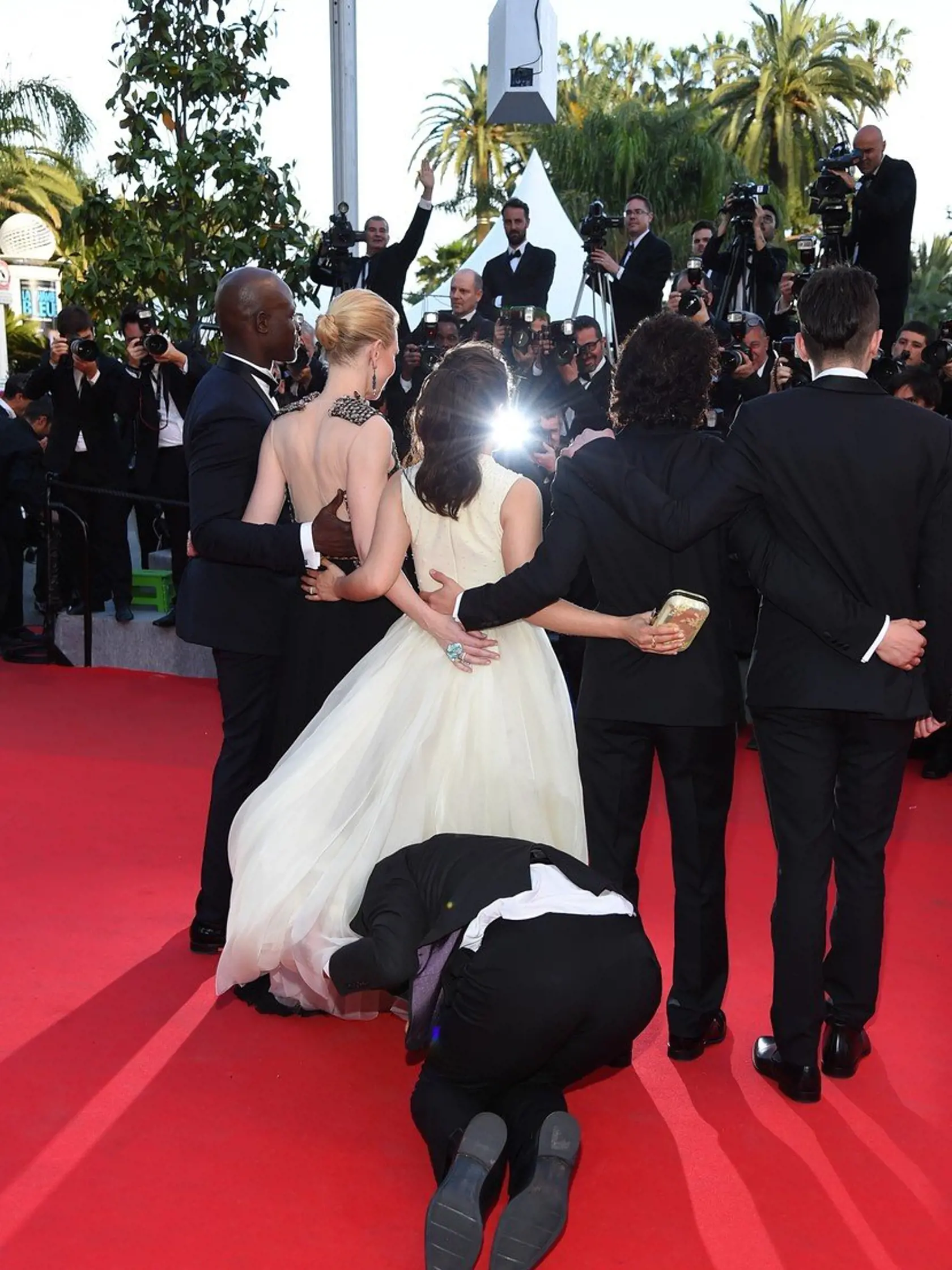 May 16, 2014: A Ukrainian journalist, 25-year-old Vitalii Sediuk, dives under America FerreraÃ¢â‚¬â„¢s dress as she poses with her Ã¢â‚¬ï¿½How to Train Your Dragon 2' costars Jay Baruchel, Kit Harington, Cate Blanchett and Djimon Hounsou during the 67th Annual Cannes Film Festival in Cannes, France.  He was immediately taken away by security., Image: 193859194, License: Rights-managed, Restrictions: US, UK, AUSTRALIA, BELGIUM, HUNGARY, NETHERLANDS, SCANDINAVIA SALES ONLY., Model Release: no, Cre
